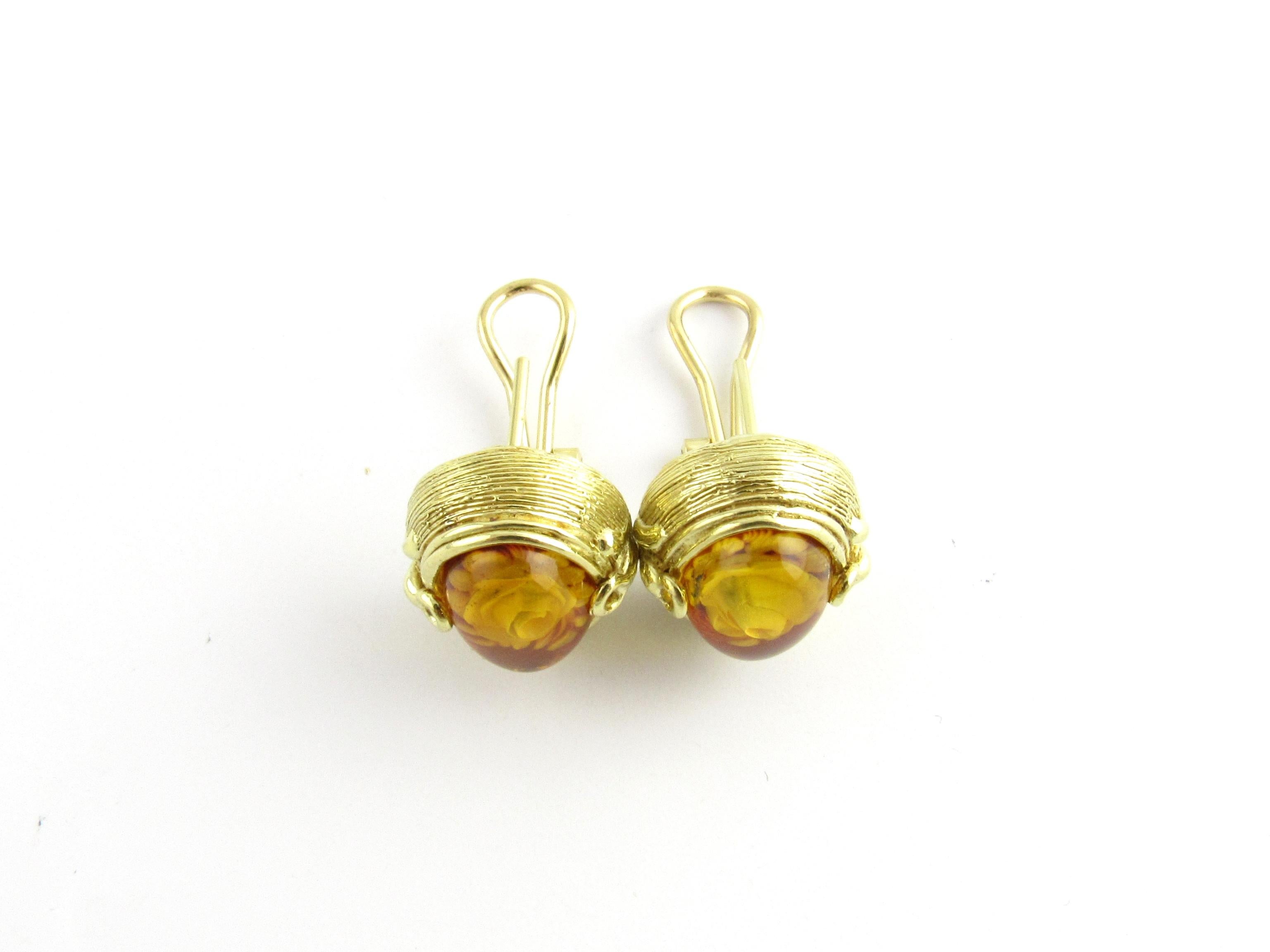 Vintage 18 Karat Yellow Gold and Amber Floral Earrings

These lovely earrings each features one amber stone with a delicate pressed flower inside. Set in beautifully detailed 18K yellow gold. Hinged closures.

Size: 17 mm x 15 mm

Weight: 8.1 dwt. /