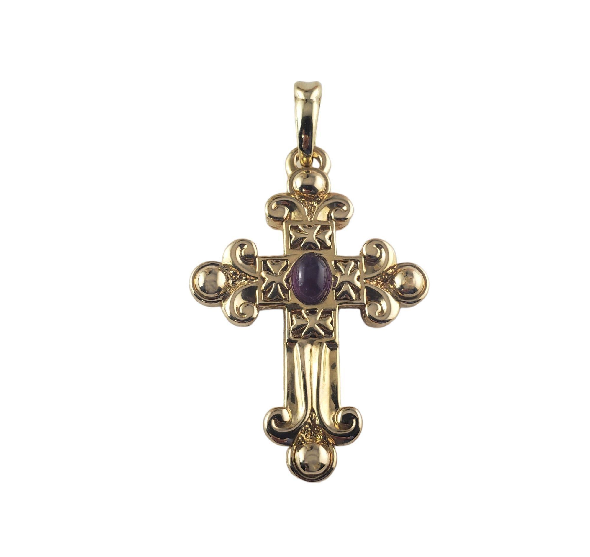 Vintage 18 Karat Yellow Gold and Amethyst across Pendant-

This lovely cross features one oval cabochon amethyst (7 mm x 5 mm) set in beautifully detailed 18K yellow gold.

Size: 50 mm x 34 mm

Weight:  5.7 gr./  3.6 dwt.

Stamped: 18K Italy

*Chain