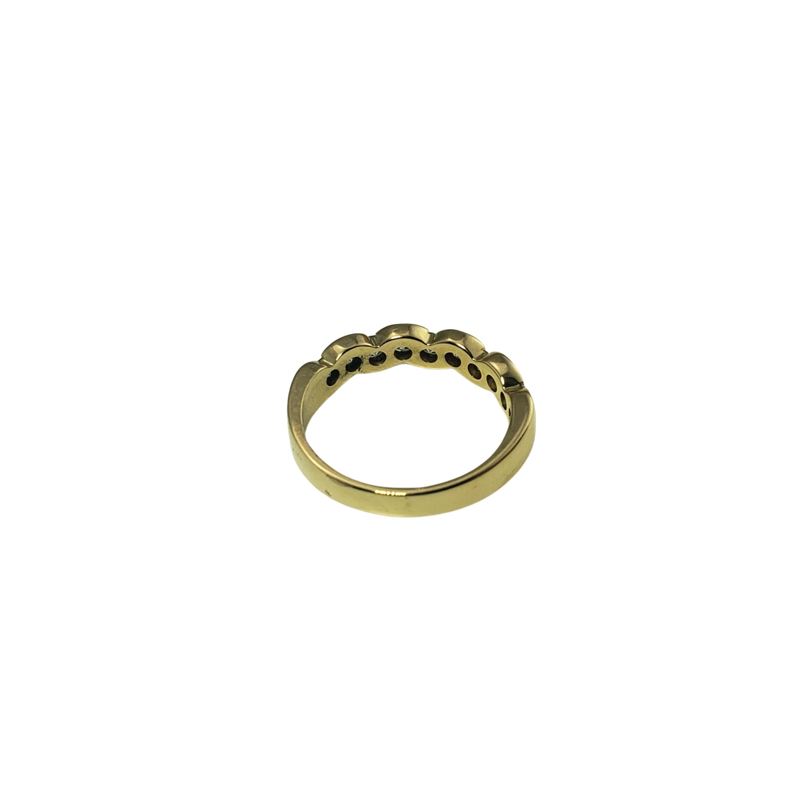 Vintage 18 Karat Yellow Gold and Diamond Ring Size 5.25-

This elegant band features ten round brilliant cut diamonds set in beautifully detailed 18K yellow gold.
Width: 4 mm. Shank: 2 mm.

Approximate total diamond weight: .40 ct.

Diamond clarity: