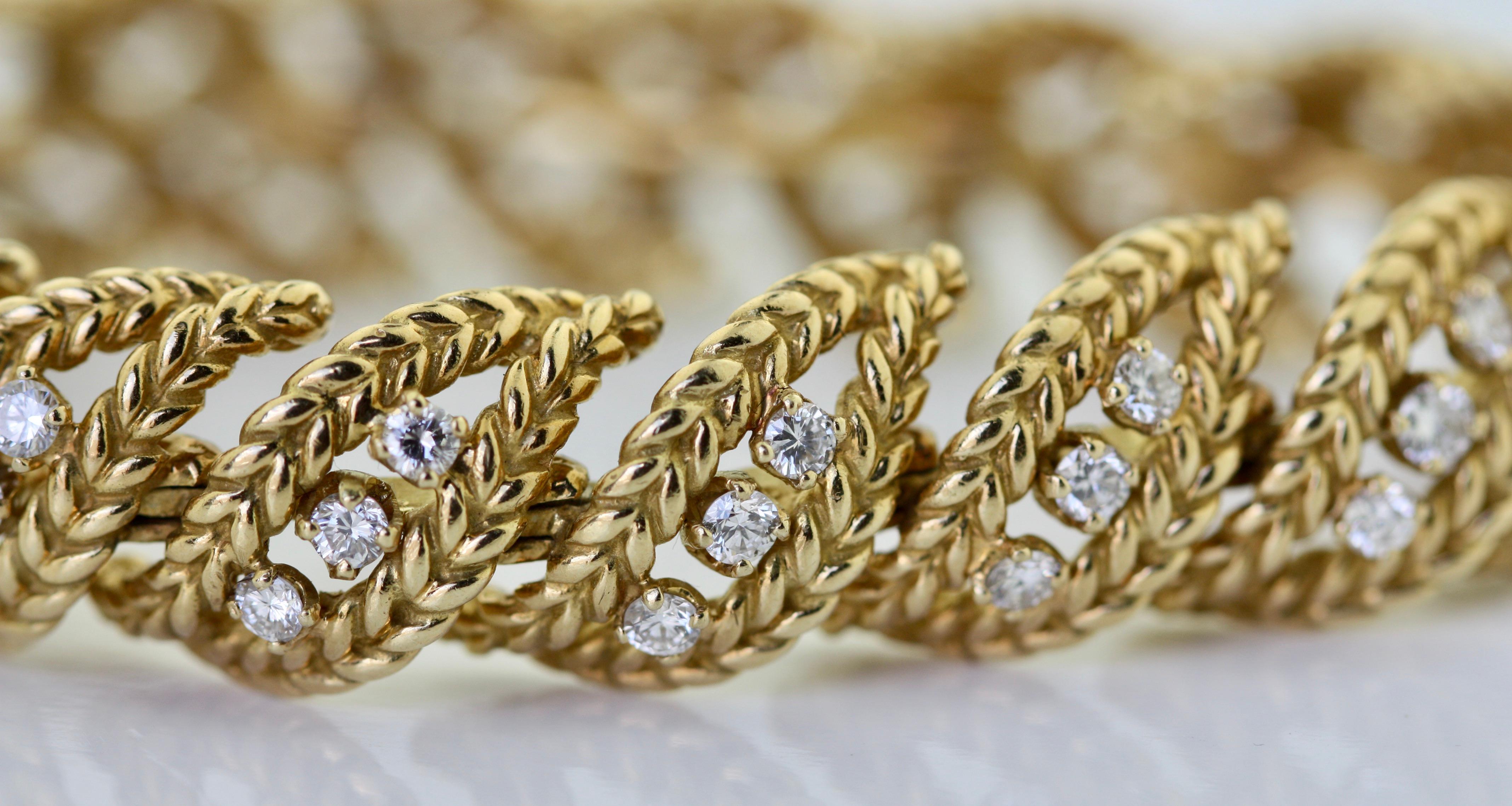 
18 Karat Yellow Gold and Diamond Bracelet
The openwork band featuring clusters of round diamonds, bordered by ribbons of textured gold.
Diamonds weighing a total of approximately 3.80 carats
Length 7 inches