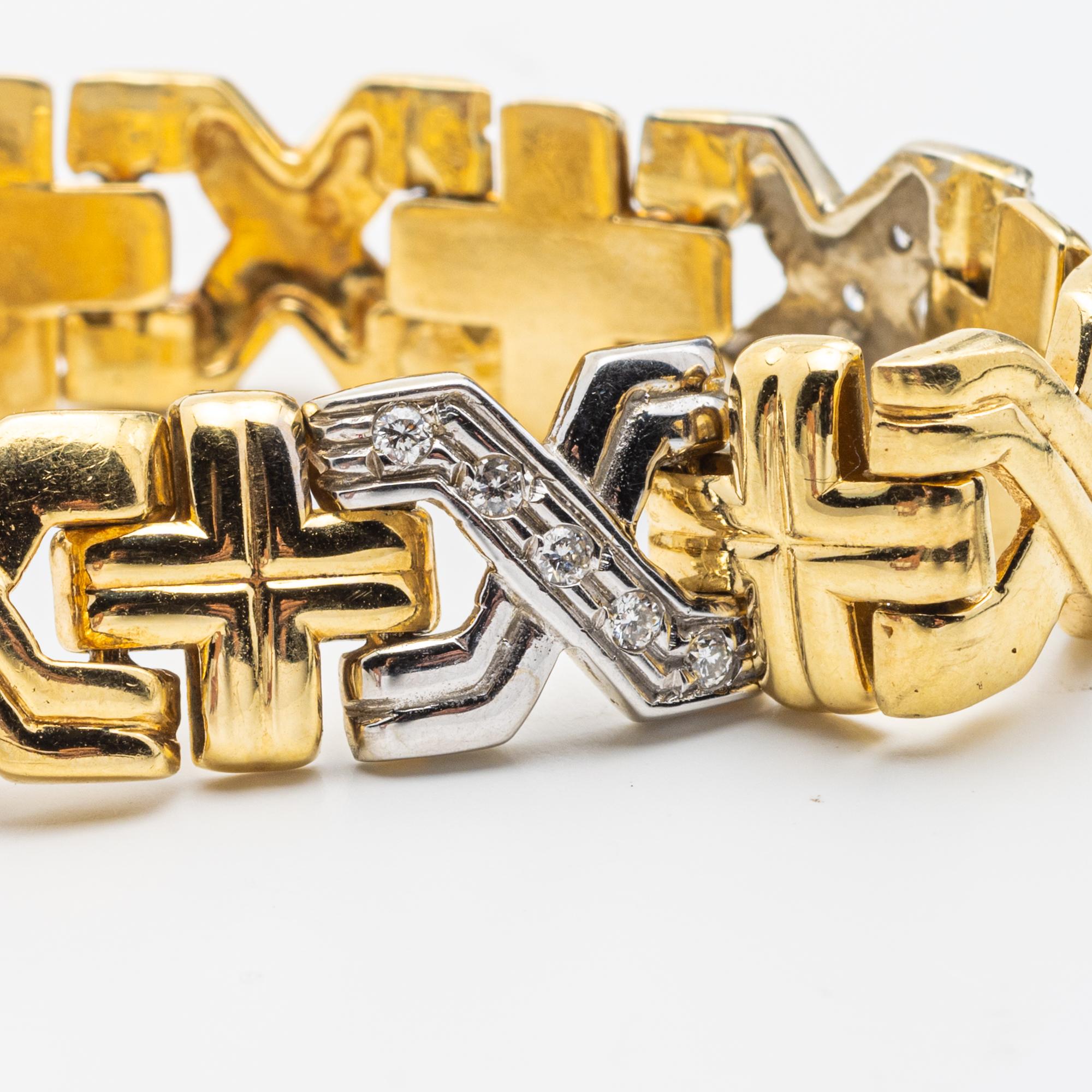 18 Karat Yellow Gold and Diamond Bracelet
Designed with x-shaped motifs, set with brilliant-cut diamonds, spaced with crosses, length approximately 7 inches, gross weight approximately 18.4 dwt, Diamonds weighing a total of approximately .75 carats