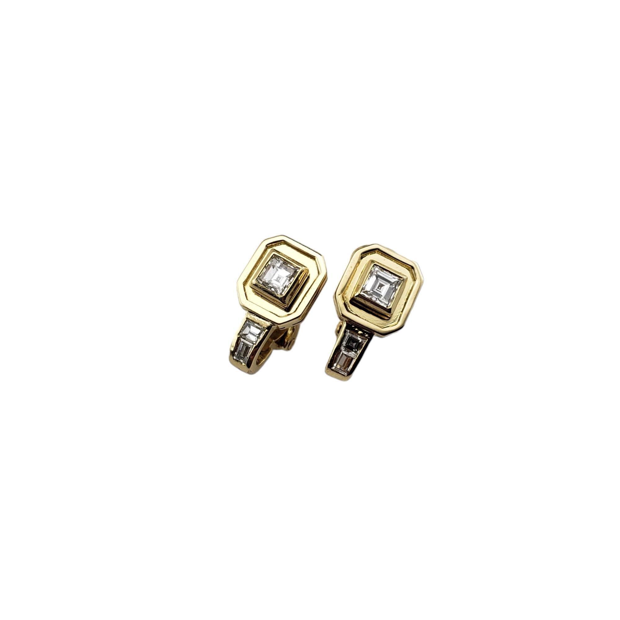 Vintage 18 Karat Yellow Gold and Diamond Clip On Earrings-

These sparkling clip on earrings each feature one princess cut diamond (.25 ct. each) and two baguette cut diamonds set in classic 18K yellow gold.

Approximate total diamond weight:  .66