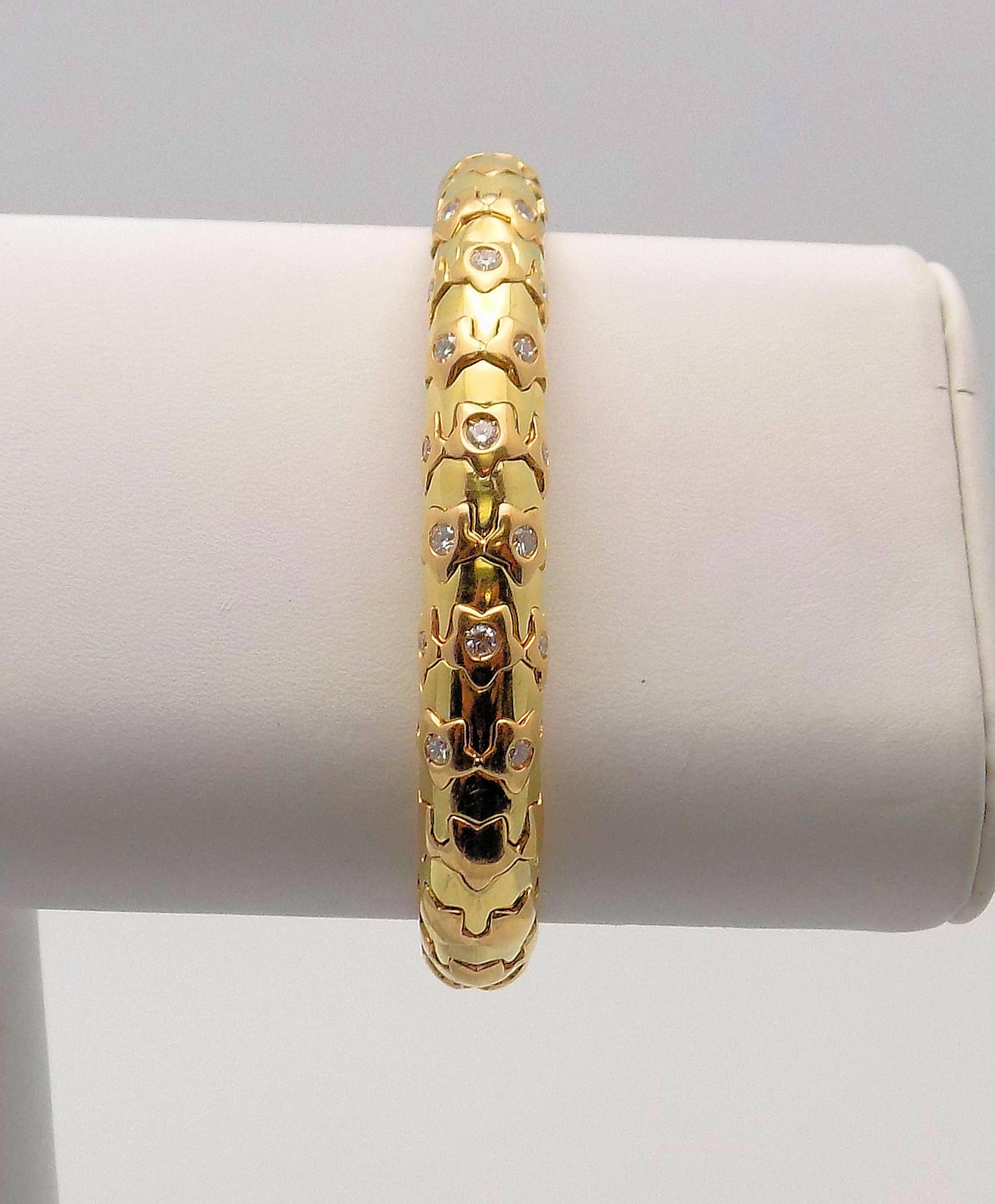 18 Karat Yellow Gold Cuff Bracelet, Star Motif, Featuring 17 Round Brilliant Diamonds 1.00 Carat Total Weight, VS, G, Signed: M. 30.7 DWT or 47.74 Grams.