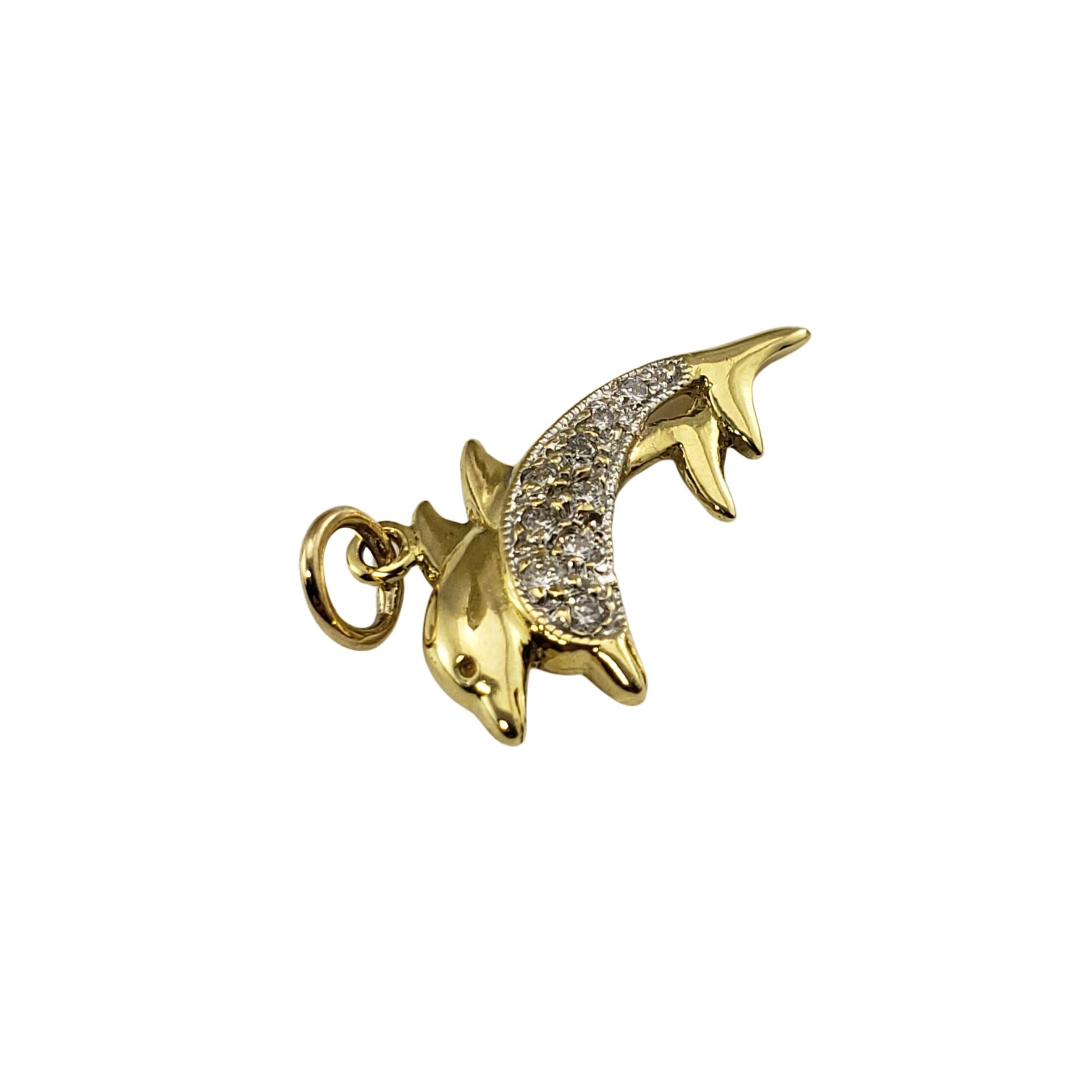 Vintage 18 Karat Yellow Gold and Diamond Dolphin Charm-

This pair of dolphins is decorated with nine round brilliant cut diamonds set in beautifully detailed 18K yellow gold.

Approximate total diamond weight:   .12 ct.

Diamond color: G

Diamond