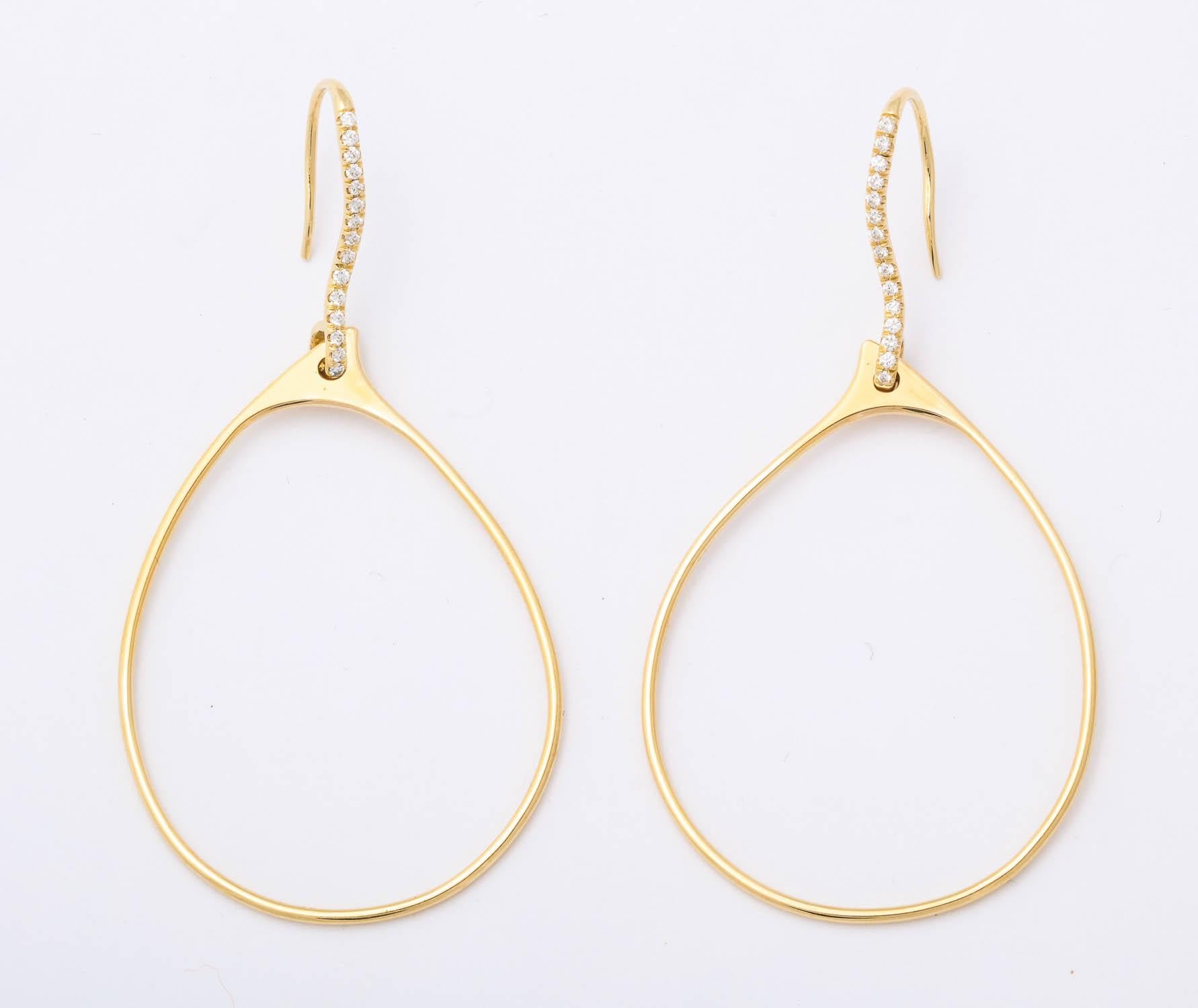 contemporary 18k yellow gold organic shaped hoop earrings on bead set diamond wires containing 30 full cut round diamonds weighing approximately 0.30 ct. total weight

