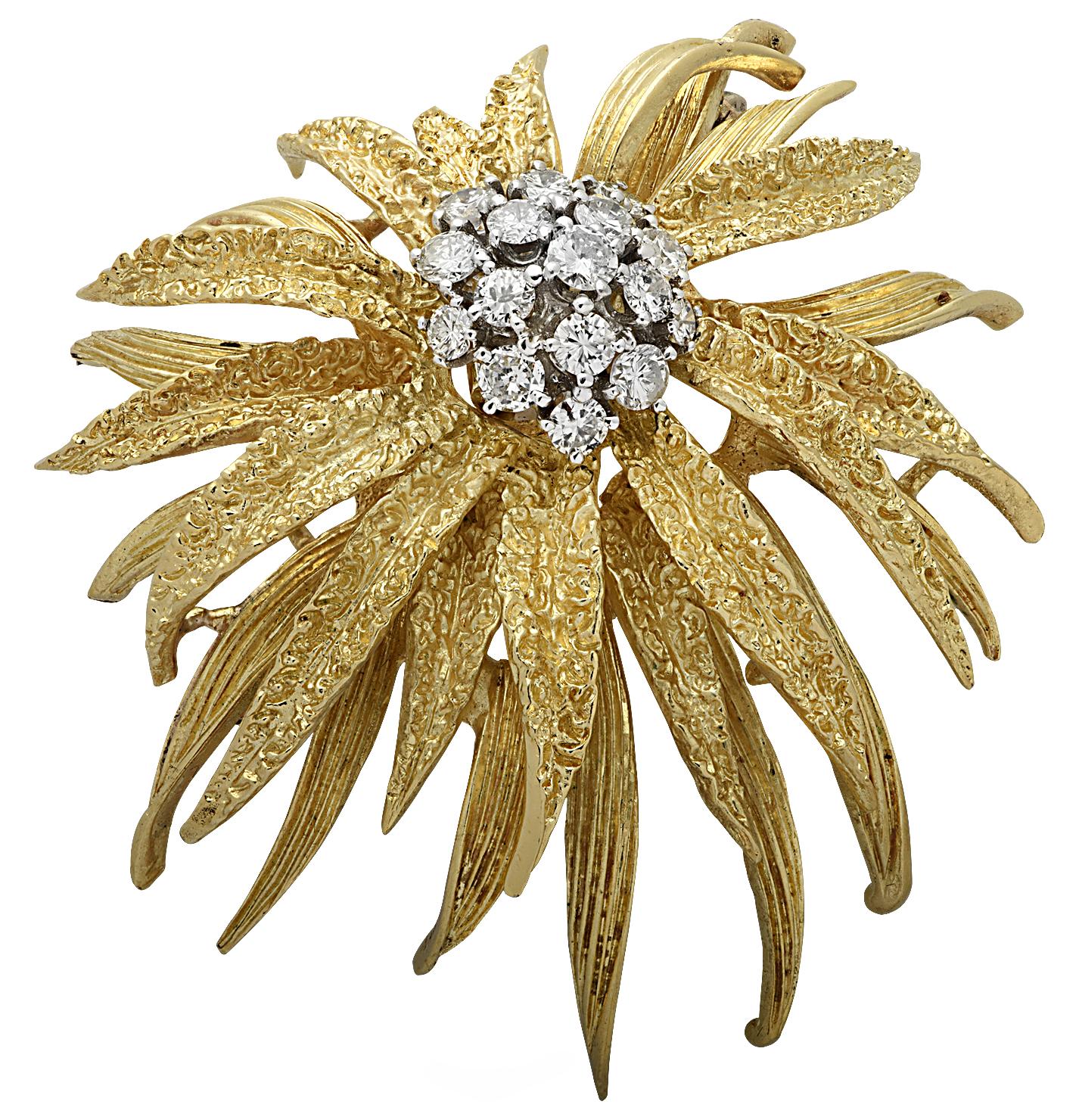 Striking En Tremblant brooch pin crafted in 18 karat yellow gold featuring 16 round brilliant cut diamonds weighing approximately 1.5 carats total, H color, SI clarity. This delightful brooch pin is fashioned into a flower with layers of textured