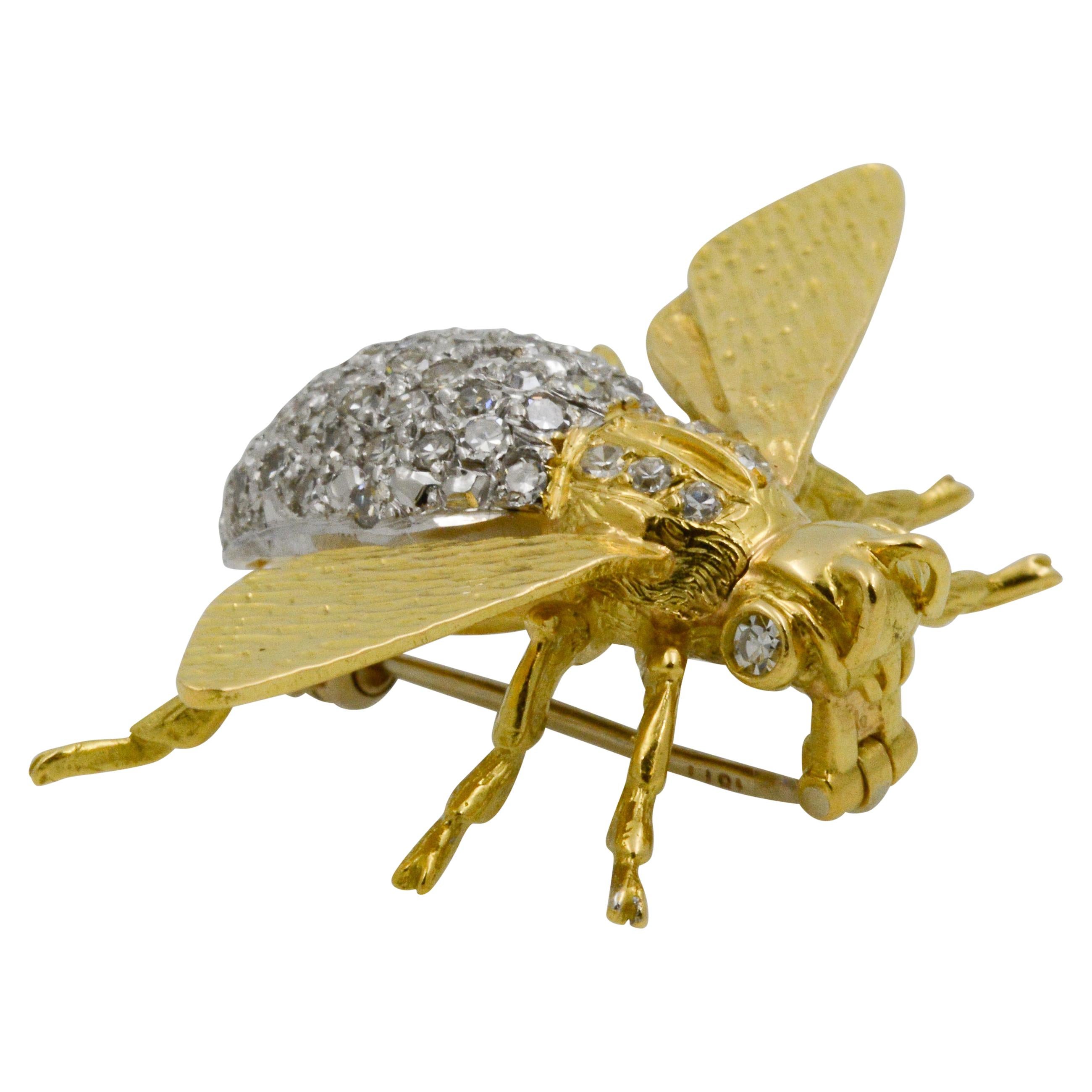 This charming 18k yellow gold fly pin features a pave diamond body with 80 single cut diamonds with a total combined weight of 1.35 carats GH SI. 