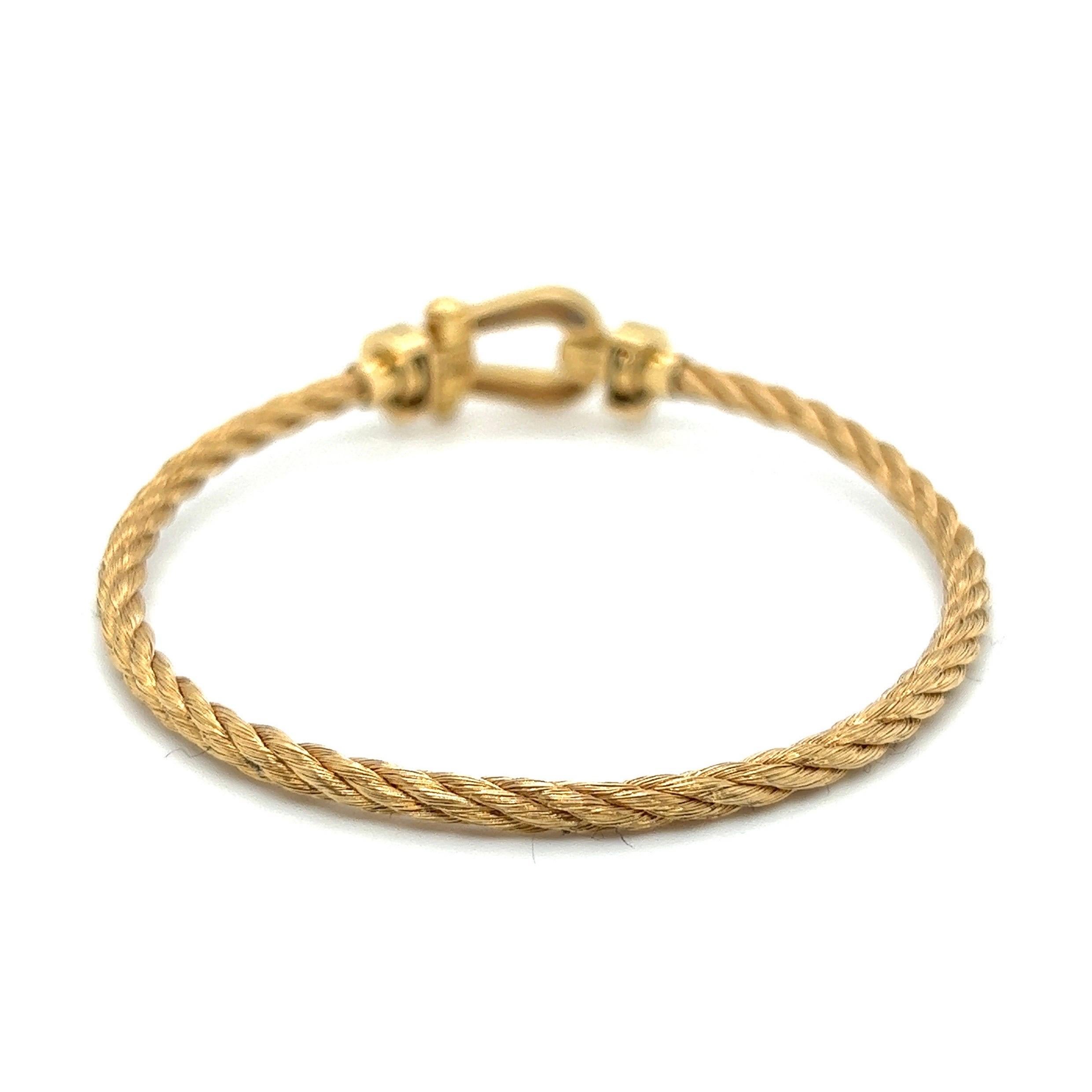 Smart casual 18 karat yellow gold and diamond Force 10 Bracelet by renowned French jewerly house Fred.

Bracelet of maritim inspired design, crafted in yellow gold 750 and composed of woven gold wire, at the front decorated with a buckle motif,
