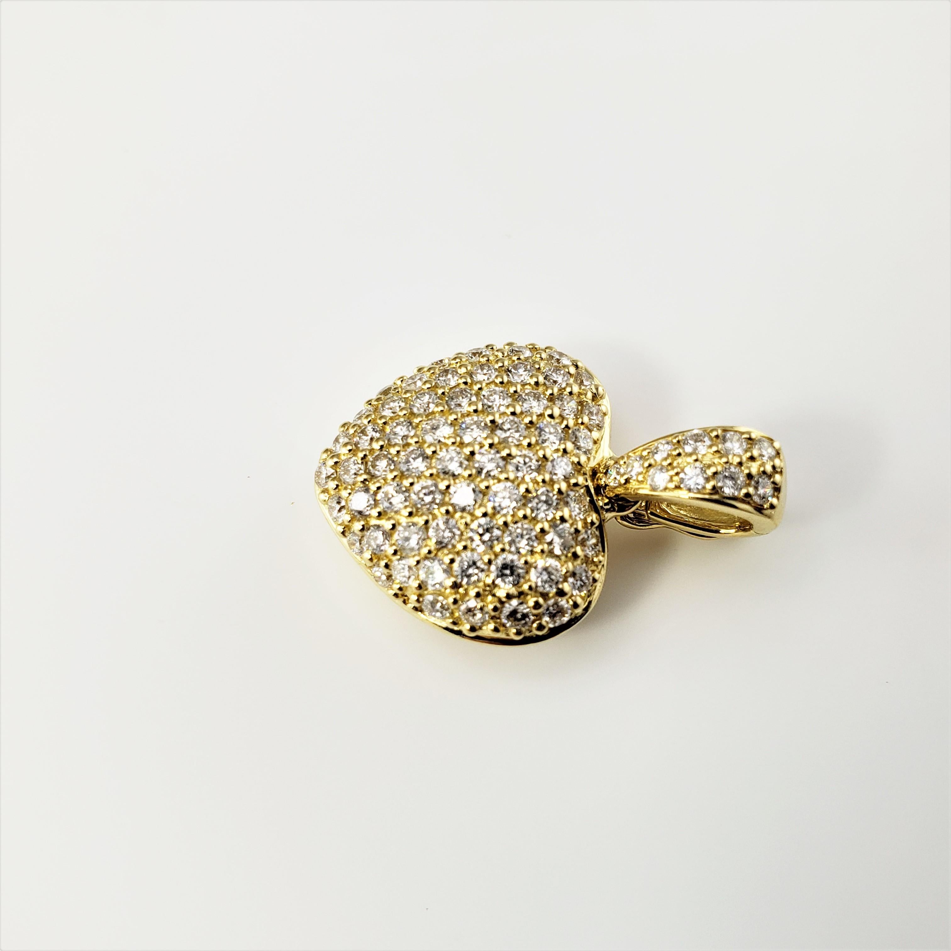 18 Karat Yellow Gold and Diamond Heart Pendant-

This sparkling heart pendant features 71 round brilliant cut diamonds set in classic 18K yellow gold.

Approximate total diamond weight:  .84 ct.

Diamond clarity:  SI1-VS2

Diamond color:  G

Size: 