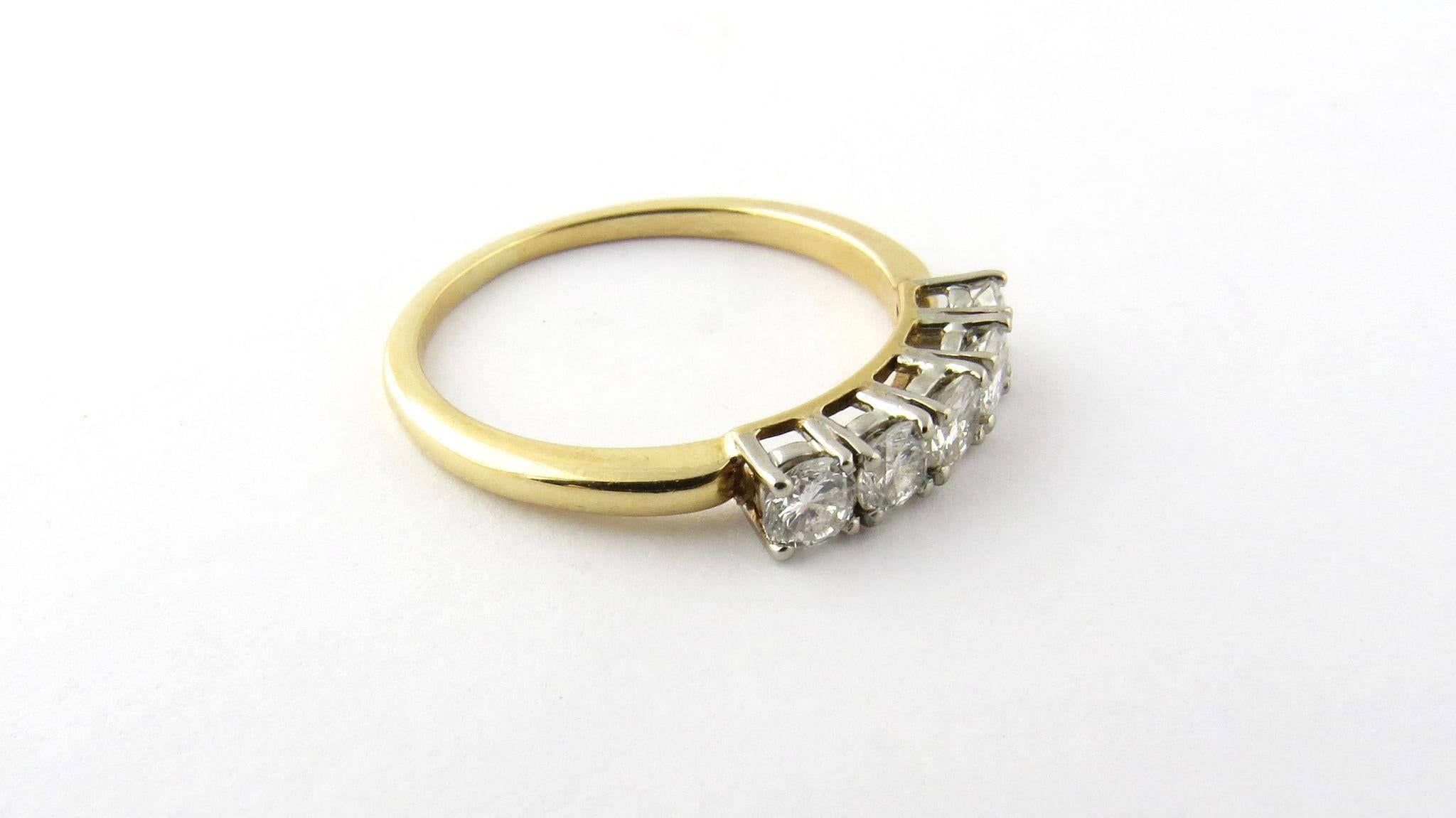 Vintage 18K Yellow Gold and Diamond Ring Size 7.75 

This diamond ring has a lot of life and sparkle! 

It is set with 5 round brilliant diamonds approx. .50 carats total. 

Diamonds are SI clarity, J color 

The front of this ring is approx. is 16