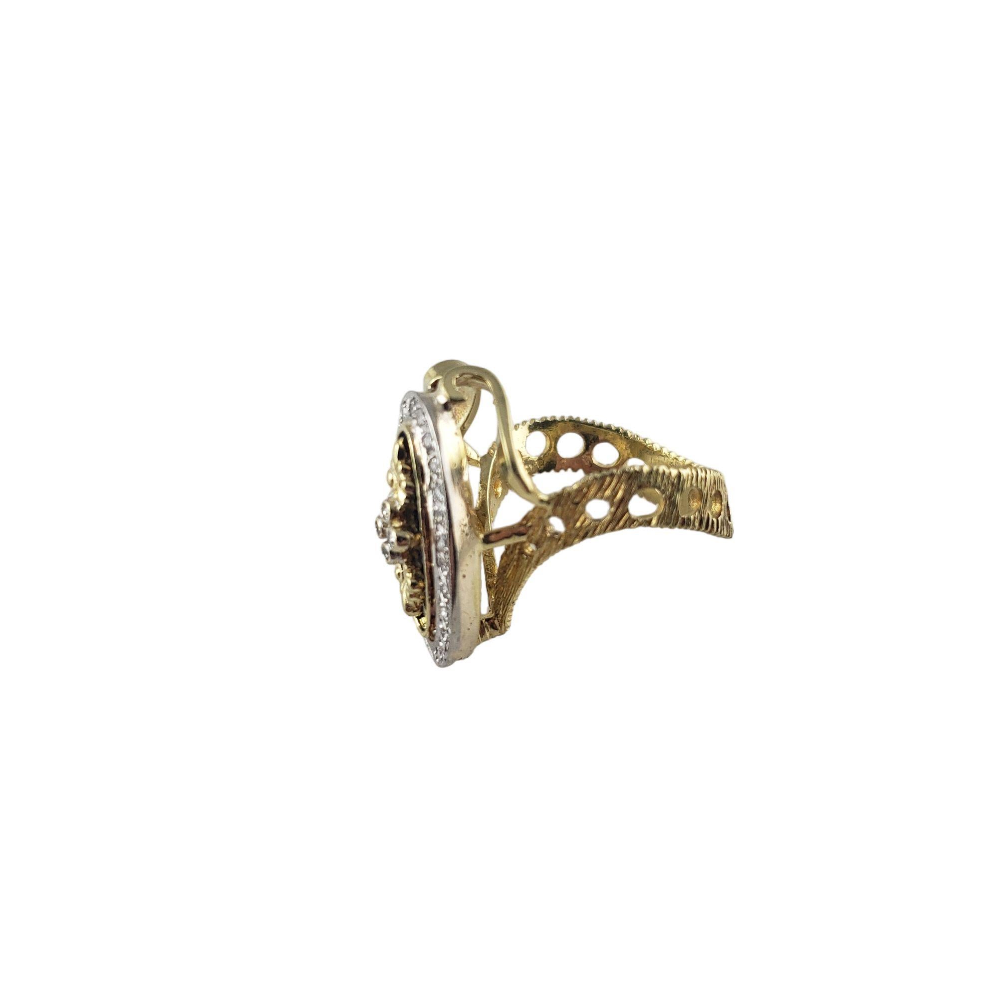 Vintage 18 Karat Yellow Gold and Diamond Ring Size 8

This lovely ring features 28 round single cut diamonds set in beautifully detailed 18K yellow gold. Top of ring measures
24 mm x 11 mm. Shank: 6 mm.

Approximate total diamond weight: .30