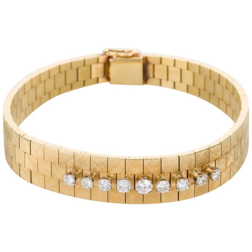 Perfectly simple and elegant, this 18k yellow gold diamond set watch strap bracelet is simple enough for an everyday look and it could become your signature piece that goes with every outfit. It can be layered with other bracelets and bangles which