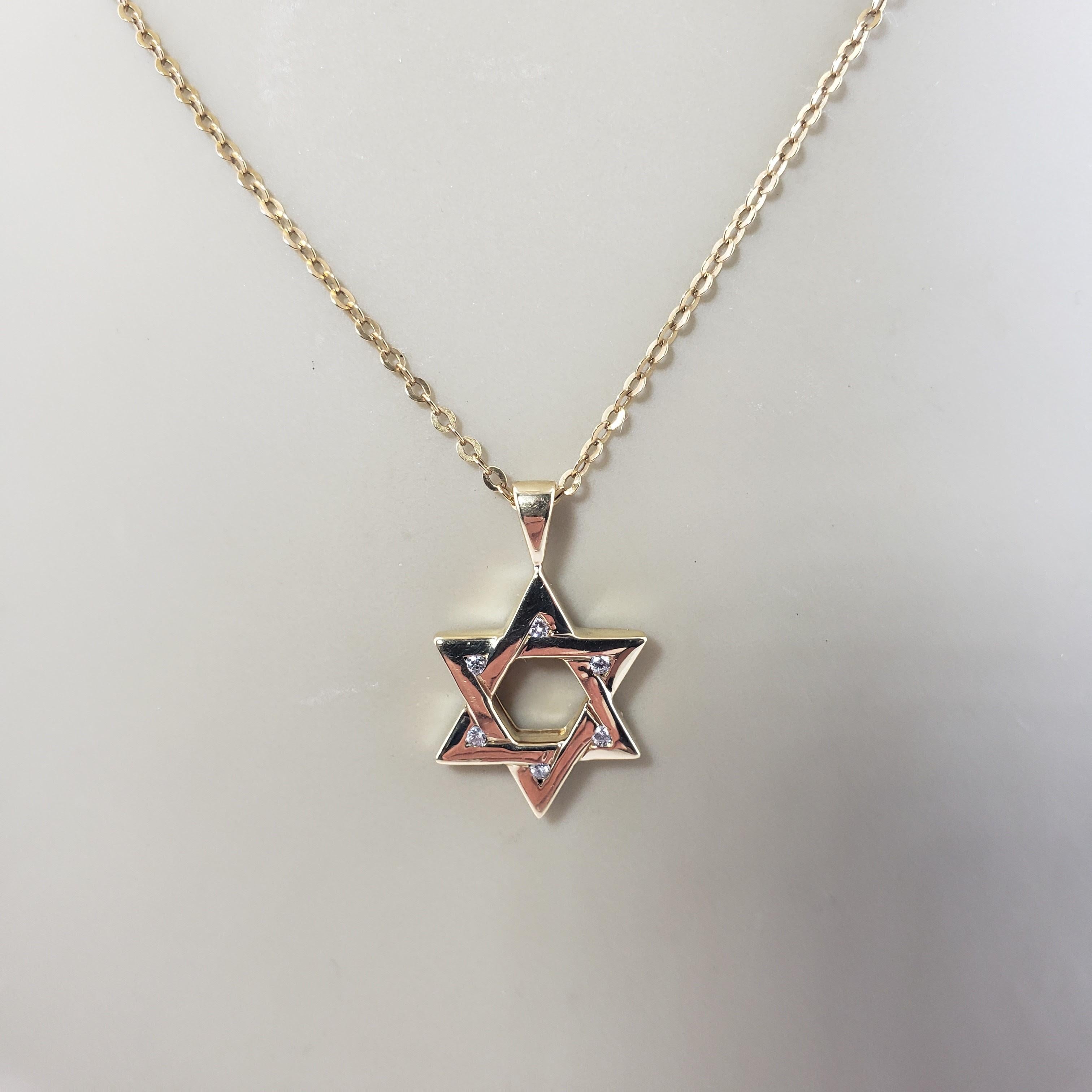 Vintage 18 Karat Yellow Gold and Diamond Star of David Pendant-

This lovely Star of David pendant features six round brilliant cut diamonds set in beautifully detailed 18K yellow gold.

Approximate total diamond weight: .06 ct.

Diamond clarity: