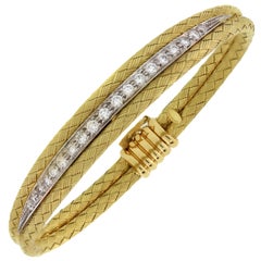 18 Karat Yellow Gold and Diamond Textured Oval Shape Bangle Bracelet