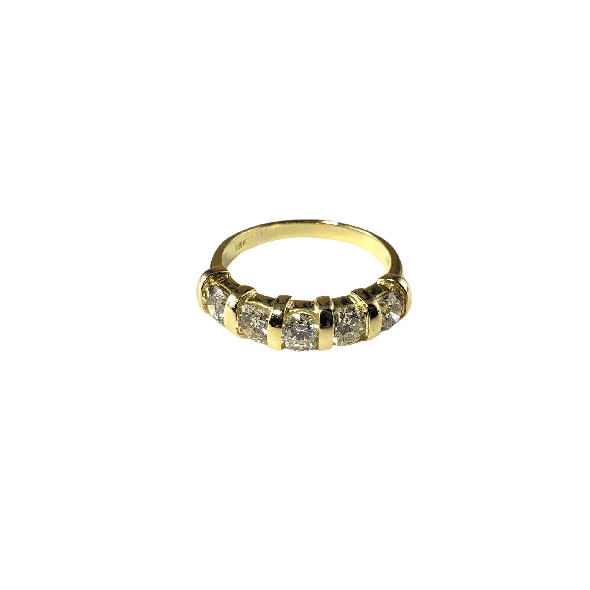 Vintage 18 Karat Yellow Gold and Diamond Wedding Band Ring Size 9.25-

This sparkling band features five round brilliant cut diamonds set in beautifully detailed 18K yellow gold.  Width:  6 mm.

Shank: 2.5 mm.

Approximate total diamond weight:  