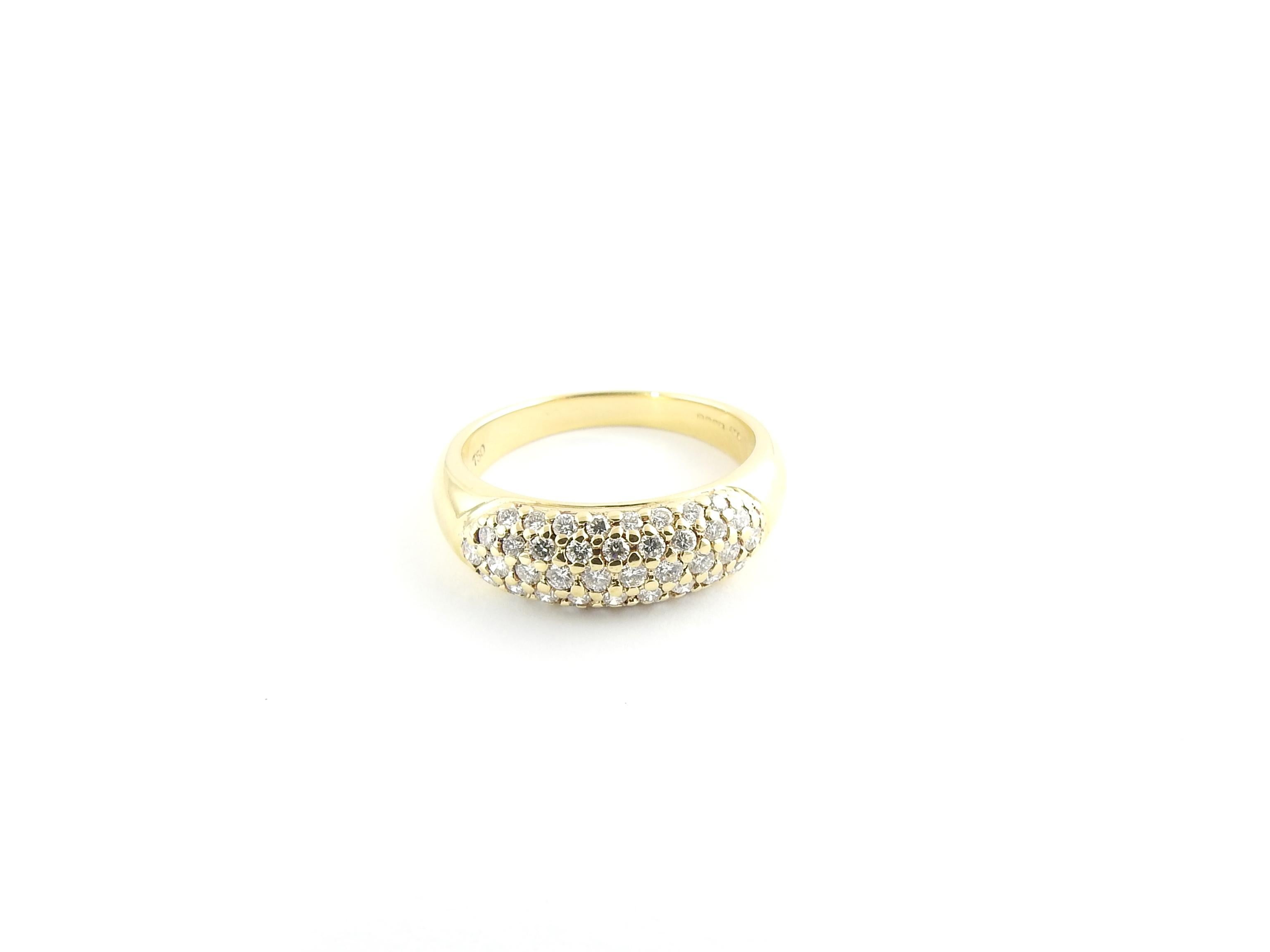 Vintage 18 Karat Yellow Gold and Diamond Ring Size 6.25

This sparkling wedding band features 44 round brilliant diamonds set in classic 18K yellow gold.

Width: 6 mm. Shank: 2 mm.

Approximate total diamond weight: .75 ct.

Diamond color: