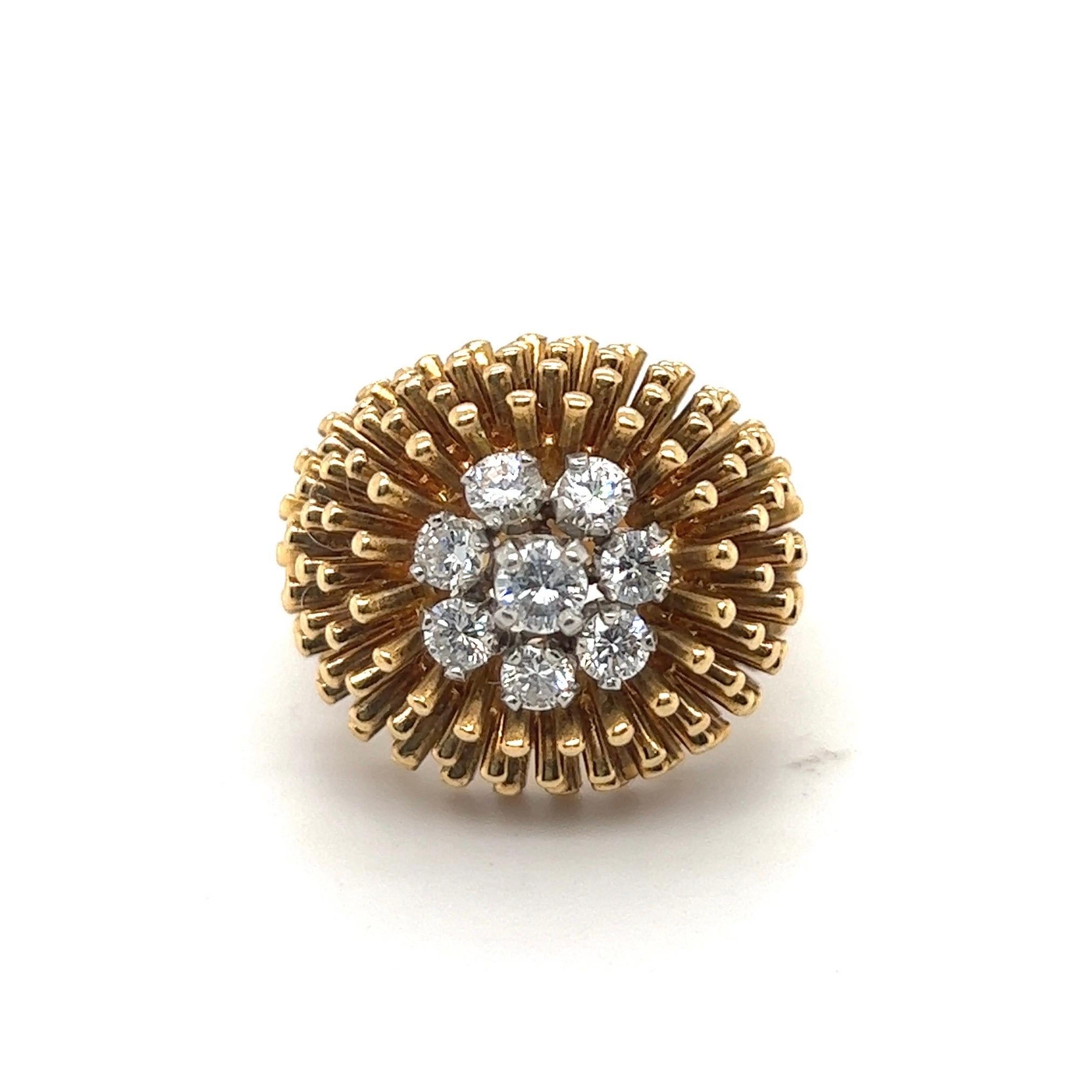 Striking 18 karat yellow gold and diamonds cocktail ring by Kutchinsky, London, 1965.
Designed as a blooming cactus, the flower set with 8 brilliant-cut diamonds totalling circa 0.65 carats, to a surround of radiating gold batons.
This ravishing