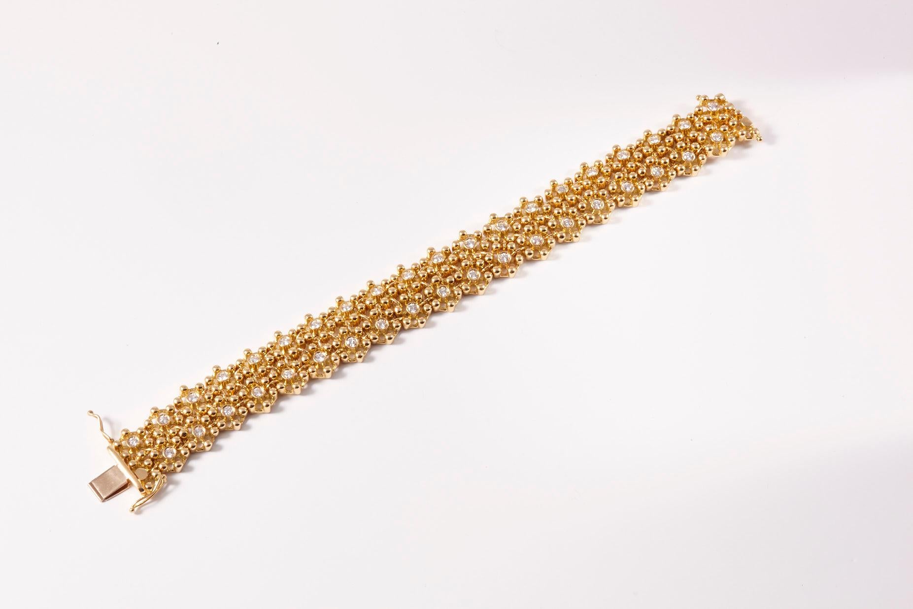 Italian made 18 Karat Yellow gold & Diamonds flower link gold bracelet.
Vintage marvel of jewelry manufacturing ingenuity, this diamond scarf bracelet will fell like liquid silk on your wrist. Showcasing the talents of master craftsmen this marvel