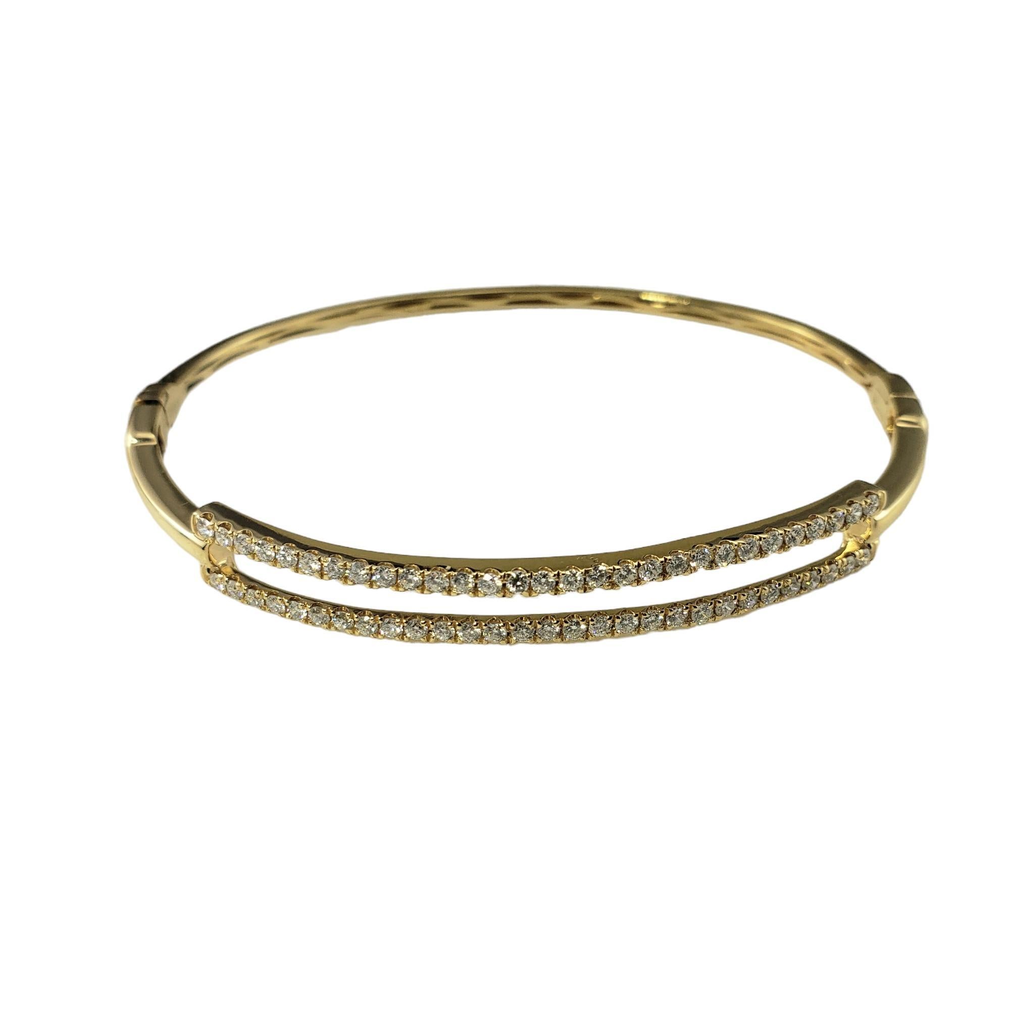 18 Karat Yellow Gold and Diamond Bangle Bracelet

This sparkling bangle bracelet features 58 round brilliant cut diamonds set in beautifully detailed 18K yellow gold.  Hinged closure.  

Width: 6 mm.

Approximate total diamond weight: .60