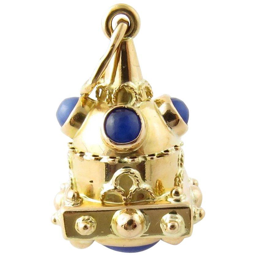 Vintage 18 Karat Yellow Gold and Genuine Lapis Pendant/Watch Fob. This lovely piece features five genuine lapis gemstones (one oval: 9 mm x 7 mm, four round: 5 mm each) set in beautifully detailed 18K yellow gold.
Size: 28 mm x 17 mm Weight: 4.1
