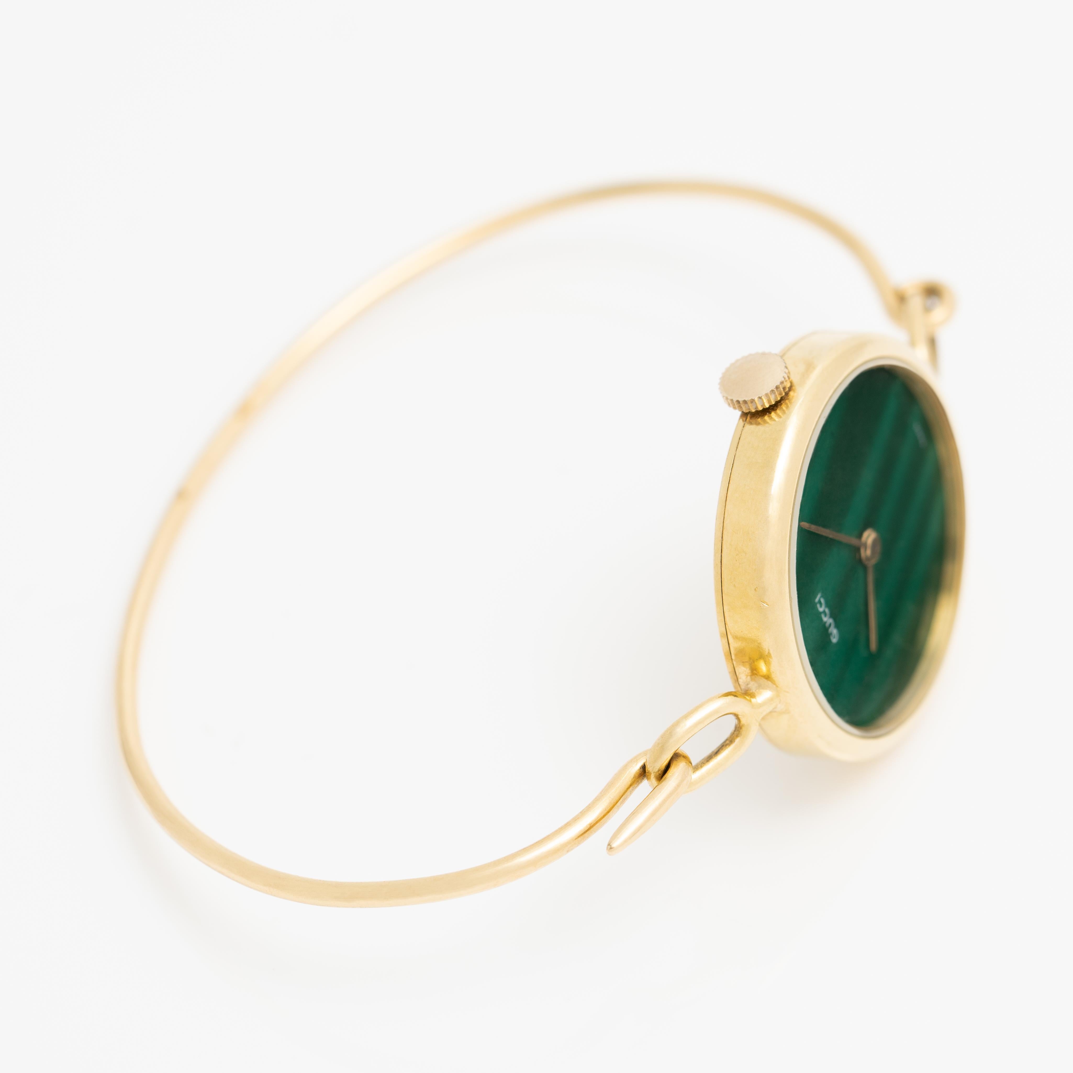 18 Karat Yellow Gold and Malachite Dial Gucci Quartz Movement Watch - 24mm 

Fits up to a 6.5