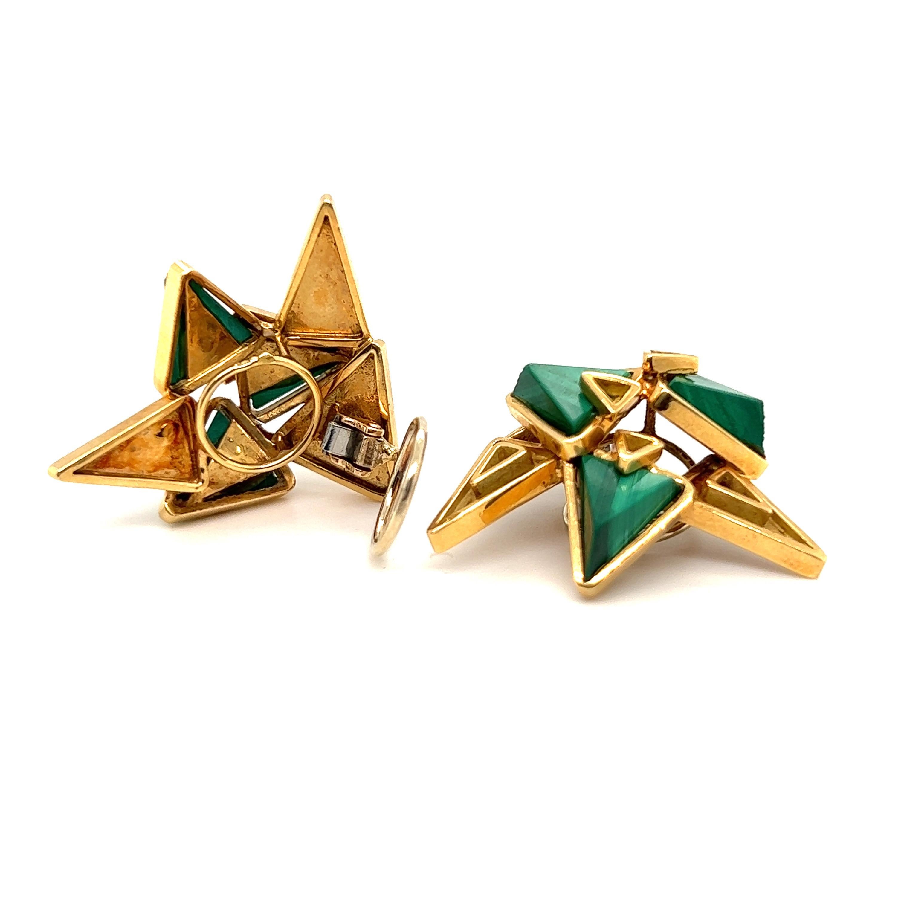 Eye-catching sculptural modernist pair of 18 karat yellow gold and malachite earrings by French jewelry house Chaumet, 1970s. 
Each designed as a cluster of triangular elements in different sizes, some of high profile finish, some set with