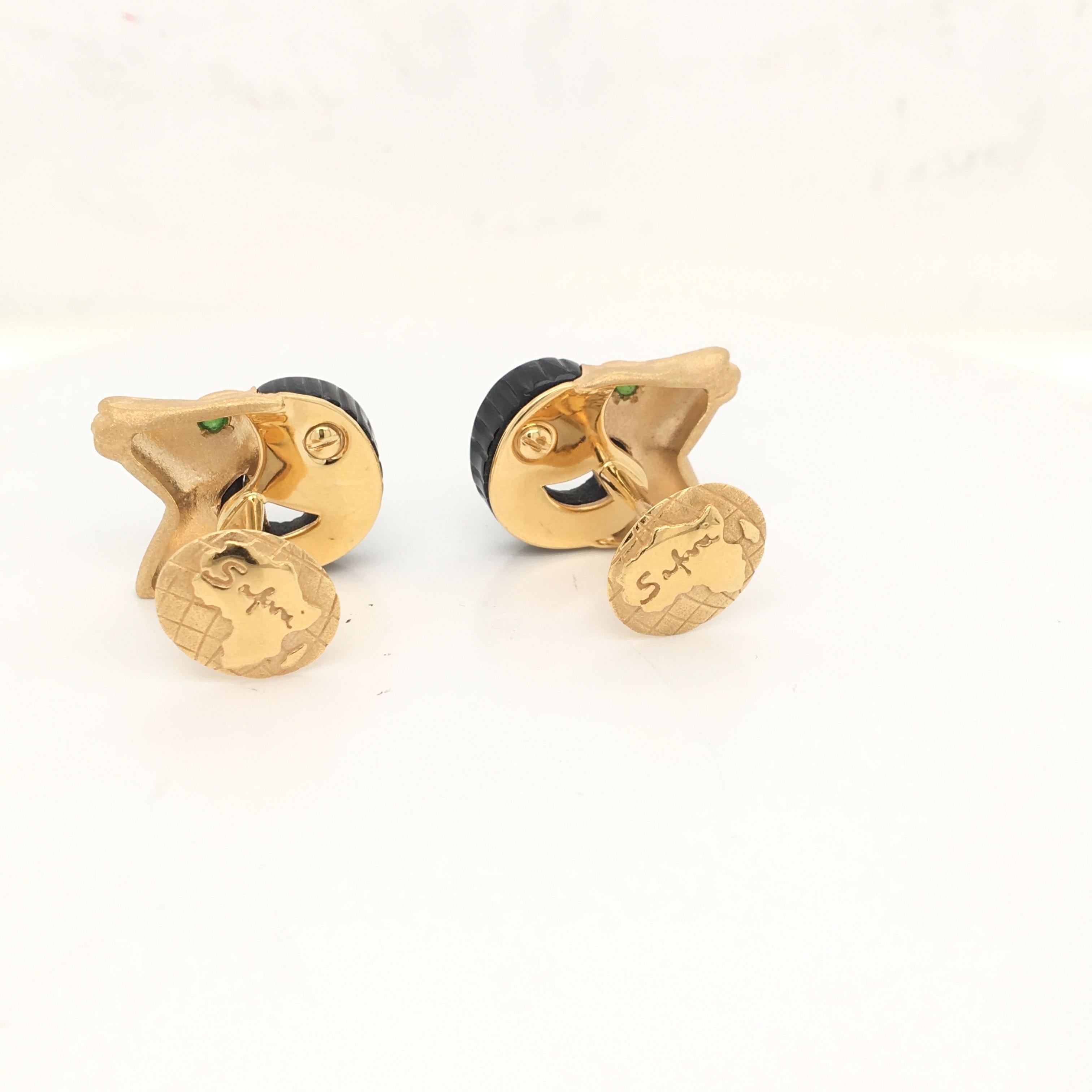 18 Karat Yellow gold cufflinks in a shape of Aries, with recut Onix the gold is satinated, in the back there is the design of the African Continent and engraved 