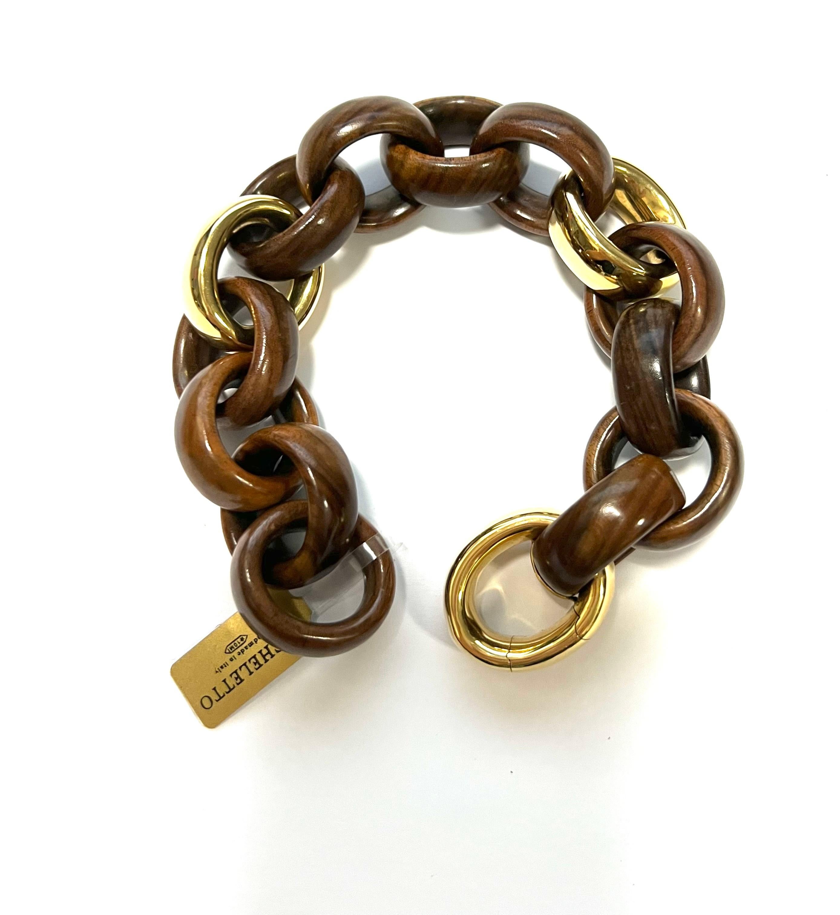 18 Karat Yellow Gold and Palissander Link Bracelet
Modern wood and yellow gold bracelet with hidden opening.
Total weight gr. 50,5
Gold weight gr. 24
Length cm 23
Stamp 750,  10 MI, ITALY  

This item can make set with 4659-Z 15/B 17 (Earrings) and