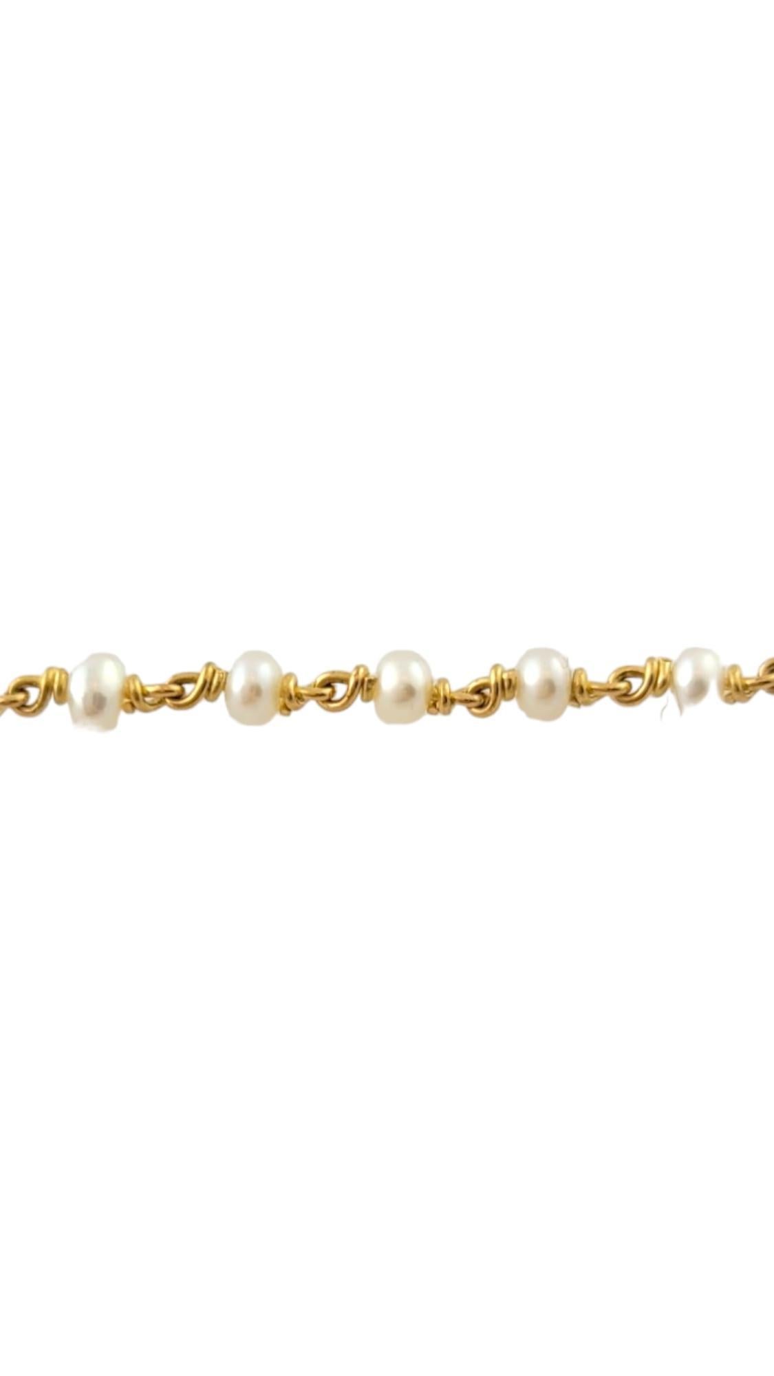 This stunning necklace features 54 pearls (3 mm each) on an elegant 18K yellow gold chain.

Size:  18 inches

Weight: 8.0 dwt. / 12.5 gr.

Acid tested for 18K gold.

Very good condition, professionally polished.

Will come packaged in a gift box or