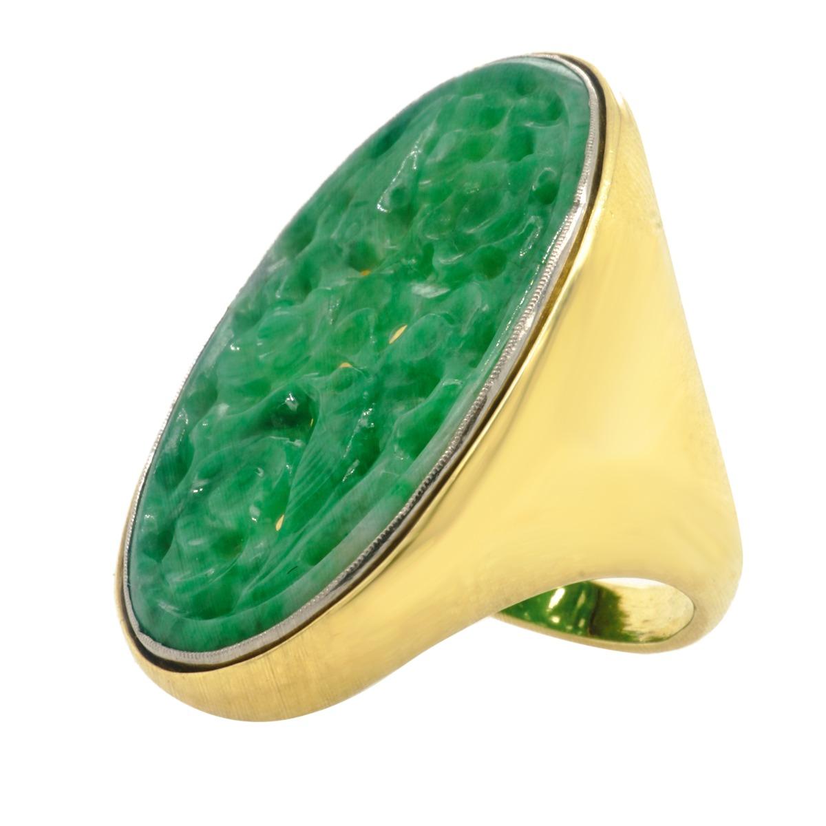 18k Yellow Gold & Platinum Carved Jade Antique Ring
Metal: 18k Yellow Gold 
Finger Size: 6.25
Gram Weight: 17.6 Grams
Gemstone:
Gemstone Weight: Carved Jade
Gemstone Cut: Oval
Gemstone Color: Green