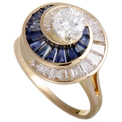 18 Karat Yellow Gold and Platinum Central Diamond Baguettes Sapphire Swirl Ring