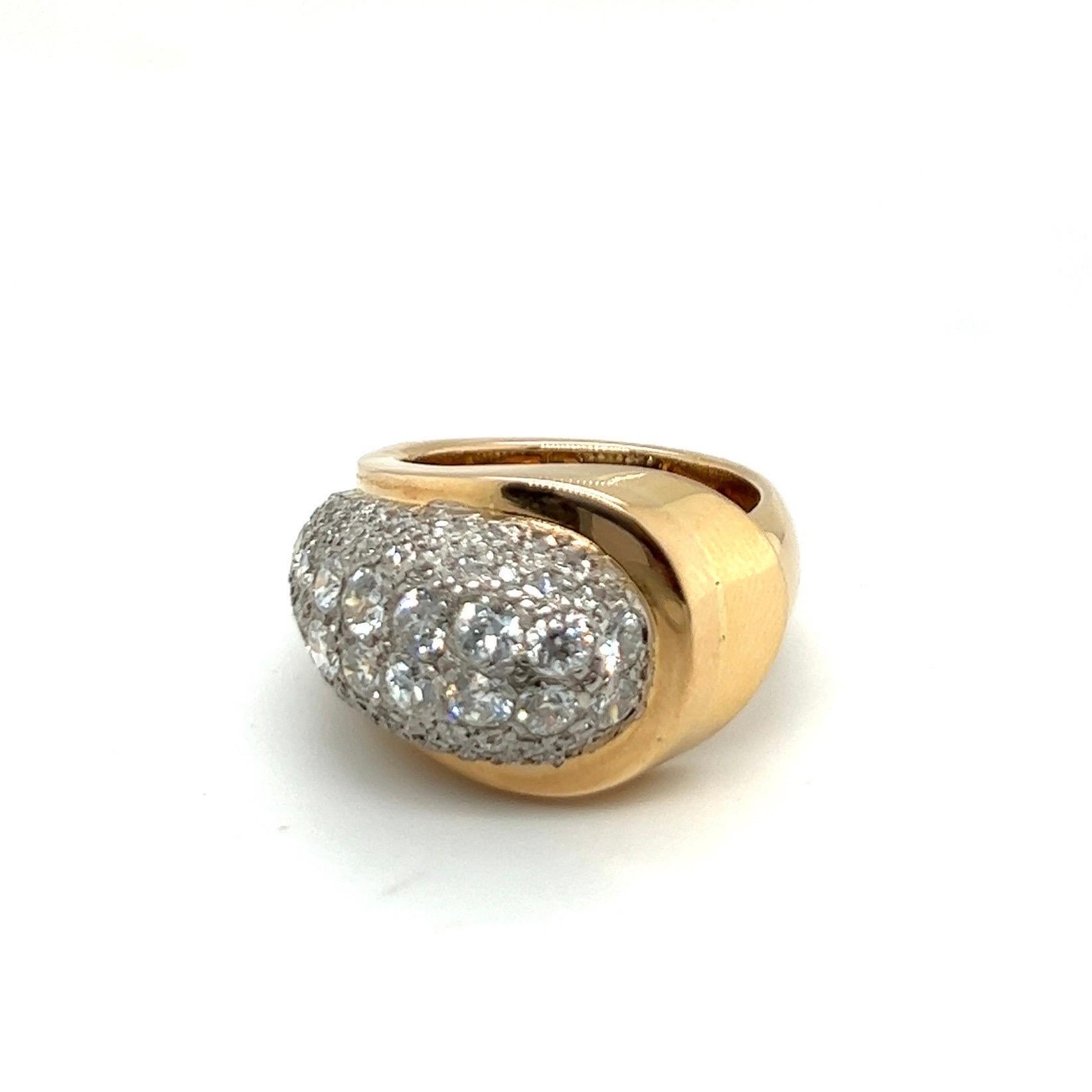 Ravishing 18 karat yellow gold, platinum and diamond Retro dress ring from the 1940s.

Eye-catching bombé band ring of asymmetrical design, crafted in 18 karat yellow gold and platinum and pavé-set with numerous single-cut and old-cut diamonds