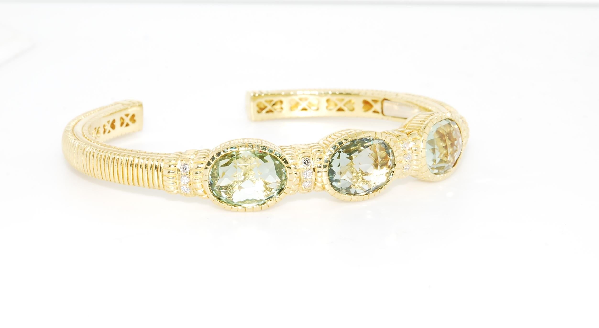 3 stone prasiolite Judith Ripka hinged cuff bracelet weighing 36.8 grams. The 3 prasiolites measure 12 x 10 mm's. The bracelet also has 12 - 1 point diamonds G/H SI clarity diamonds. Beautiful soft, rich look to this bracelet, and just the right