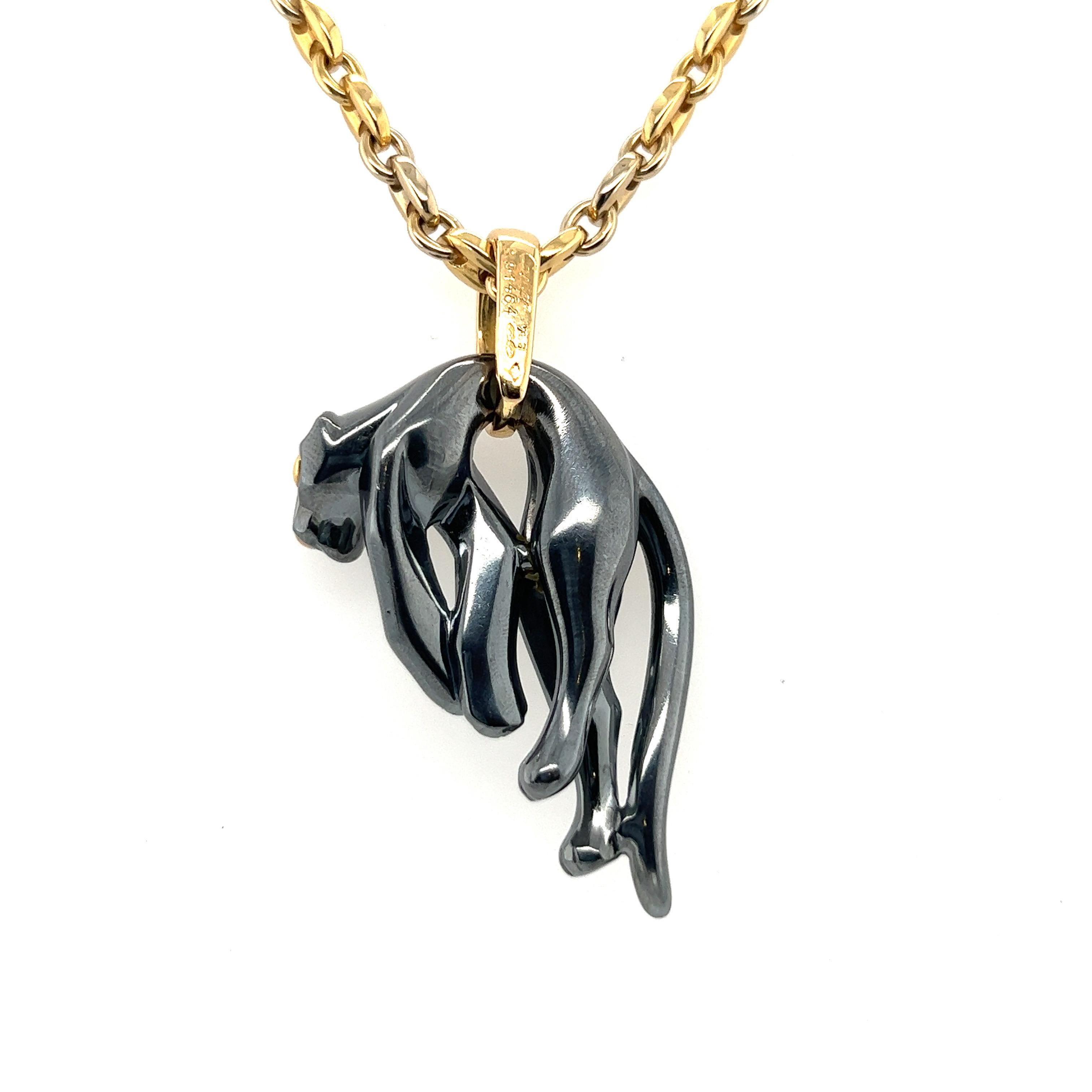 Attractive pendant designed as a sculpted, hanging silverium panther, with polished gold eyes and nose, elegantly suspended from a yellow gold bail. It is accompanied by a chic 18 karat yellow gold Gucci chain necklace of circa 46 cm (18.11