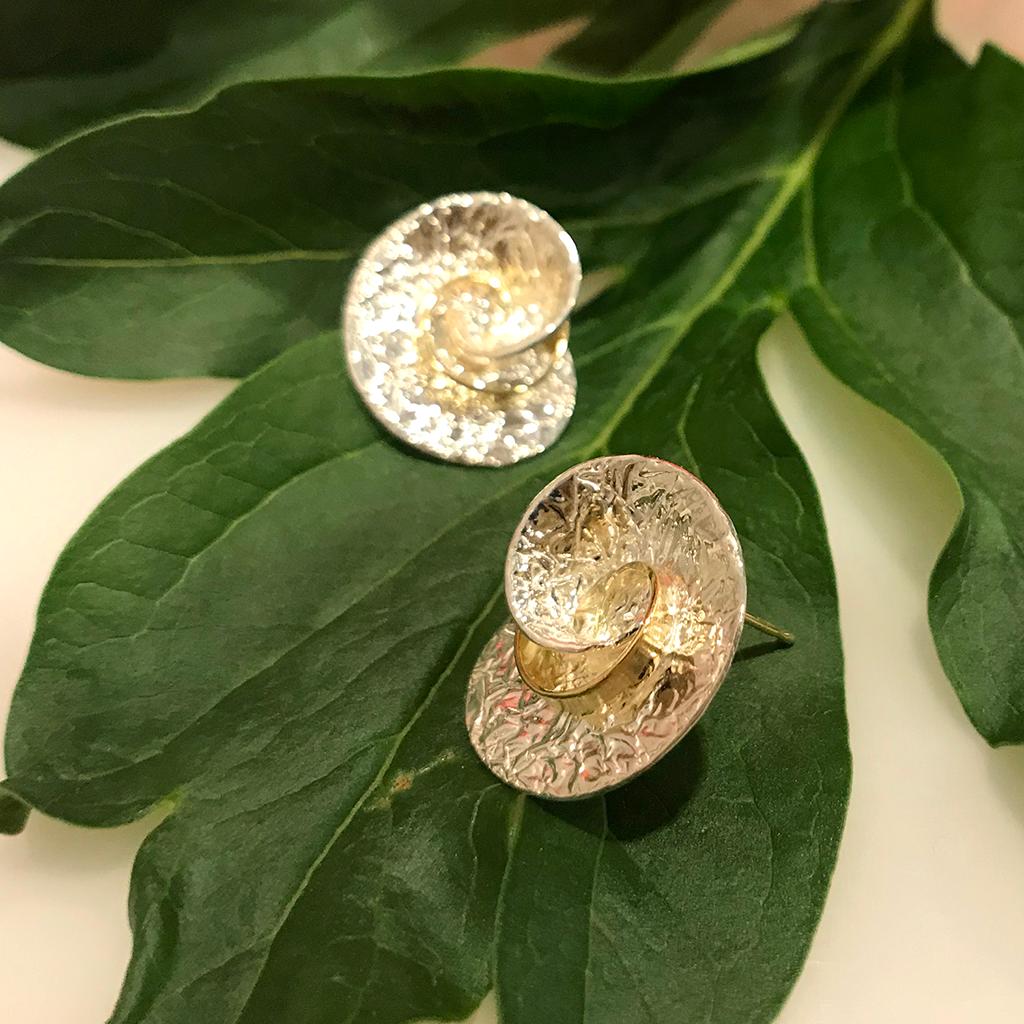 These contemporary Swirl Earrings from jewelry artist Keiko Mita are handmade from 18 Karat Yellow Gold and tarnish resistant Sterling Silver. The designer earrings from the artist's Washi Collection are 18 mm long and 15 mm wide. Washi is