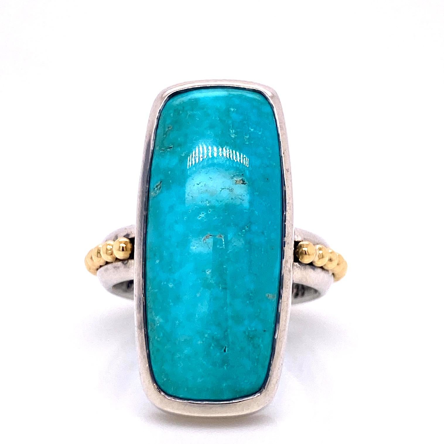 An 18k yellow gold and sterling silver ring bezel set with a 13 carat rectangular Kingman turquoise. Ring size 7. This ring was designed and made by llyn strong.