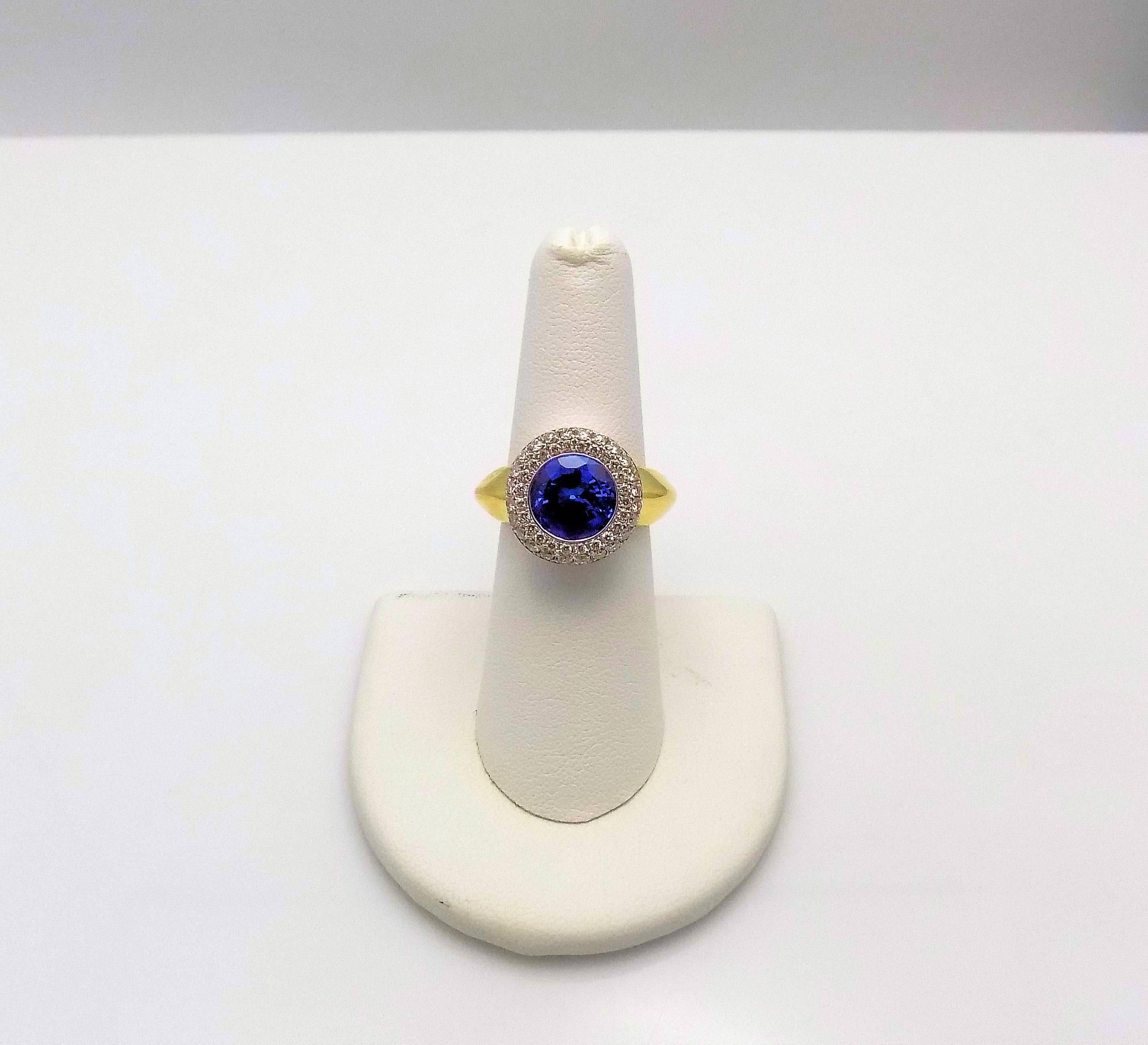 Round Cut 18 Karat Yellow Gold and White Gold Tanzanite and Diamond Ring For Sale