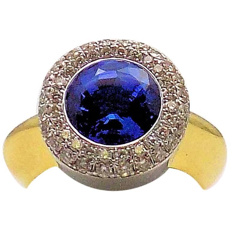18 Karat Yellow Gold and White Gold Tanzanite and Diamond Ring For Sale