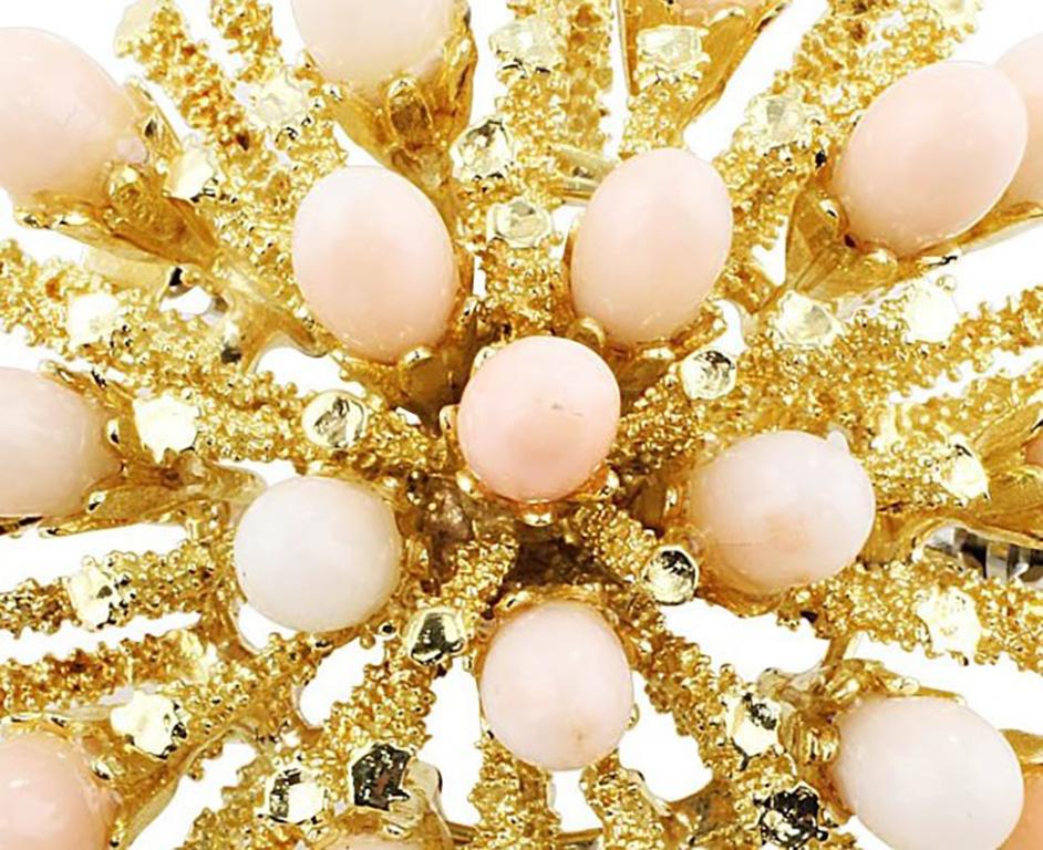 Angel Skin Coral Brooch. 18k yellow gold sea urchin brooch set with angel skin coral cabochons. The brooch weighs 28gms.