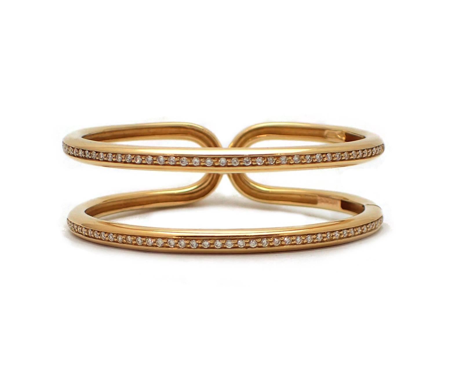 Open Antonini cuff bracelet in 18k yellow gold accented with almost one carat of diamonds, G-H color, VS clarity.