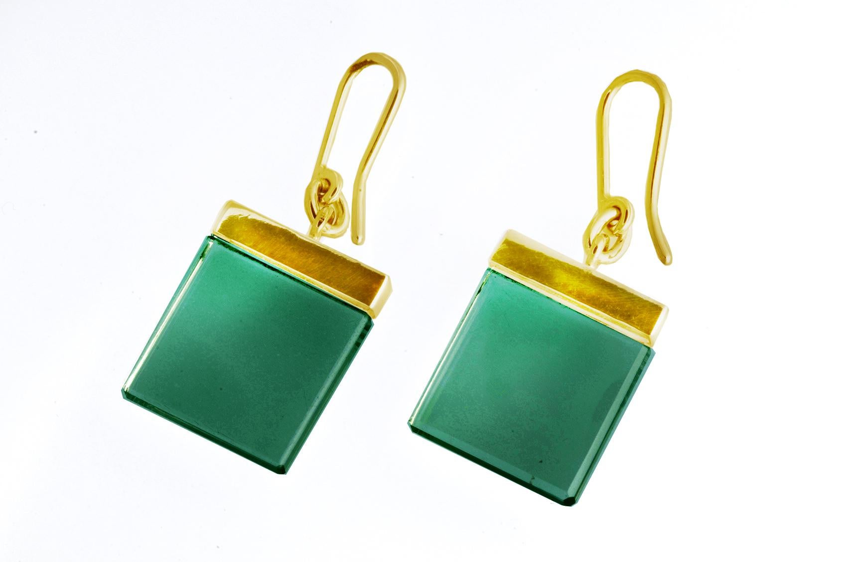 The Ink collection has been featured in both Harper's Bazaar UA and Vogue UA publications. These artisan earrings are crafted from 18 karat yellow gold and feature deep green lab-grown quartzes measuring 15x15x3mm that are open to the light and