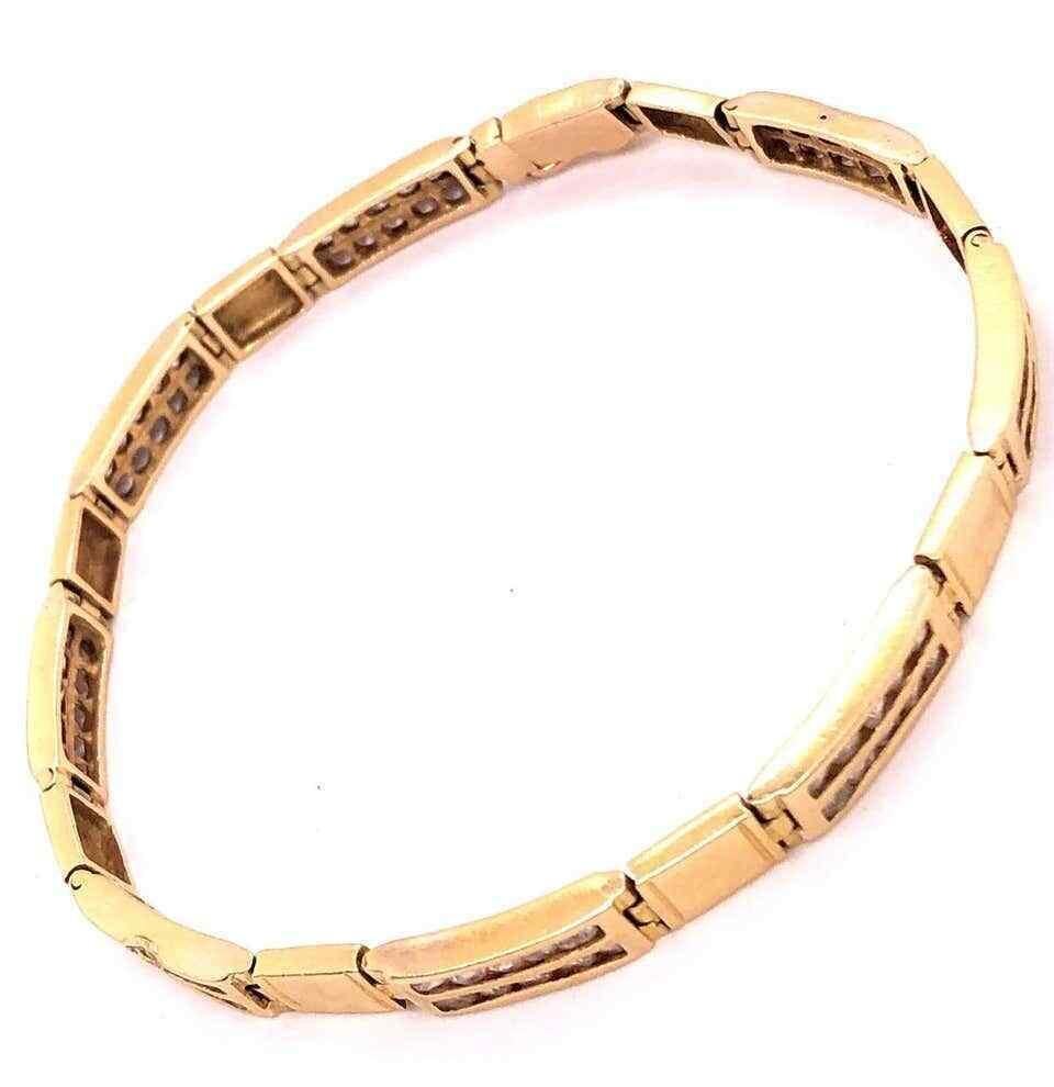 18-karat yellow gold fancy link bracelet with diamonds.
A sleek and stylish Art Deco design bracelet fit for a man or a woman having eight box design fittings with ten small diamonds set in the center. Stamped. Weight: 13.8 grams. Measures: Length