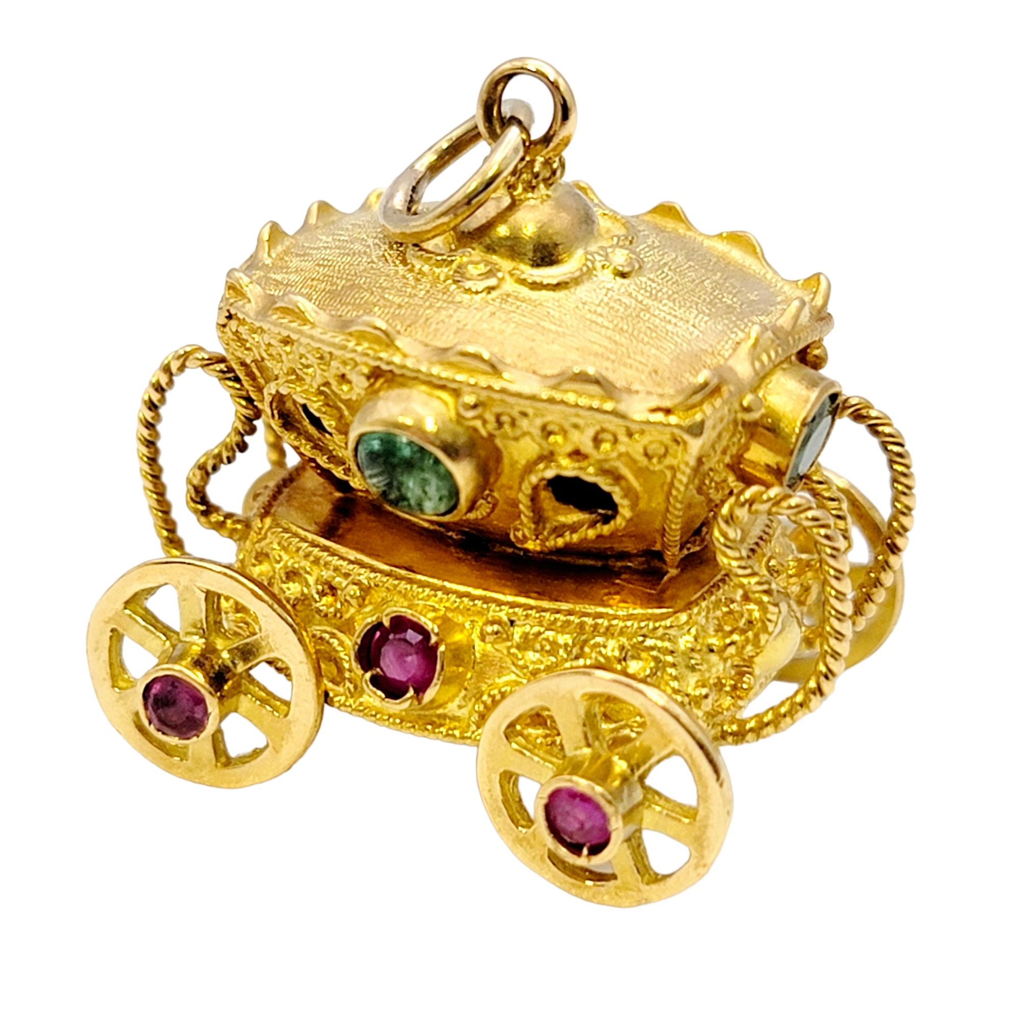 Unique multi-gemstone carriage charm/pendant with incredible fine details. The perfect addition to your favorite charm bracelet or necklace, this lovely piece is a miniature work of art. 

This charming piece features an intricately carved 18 karat