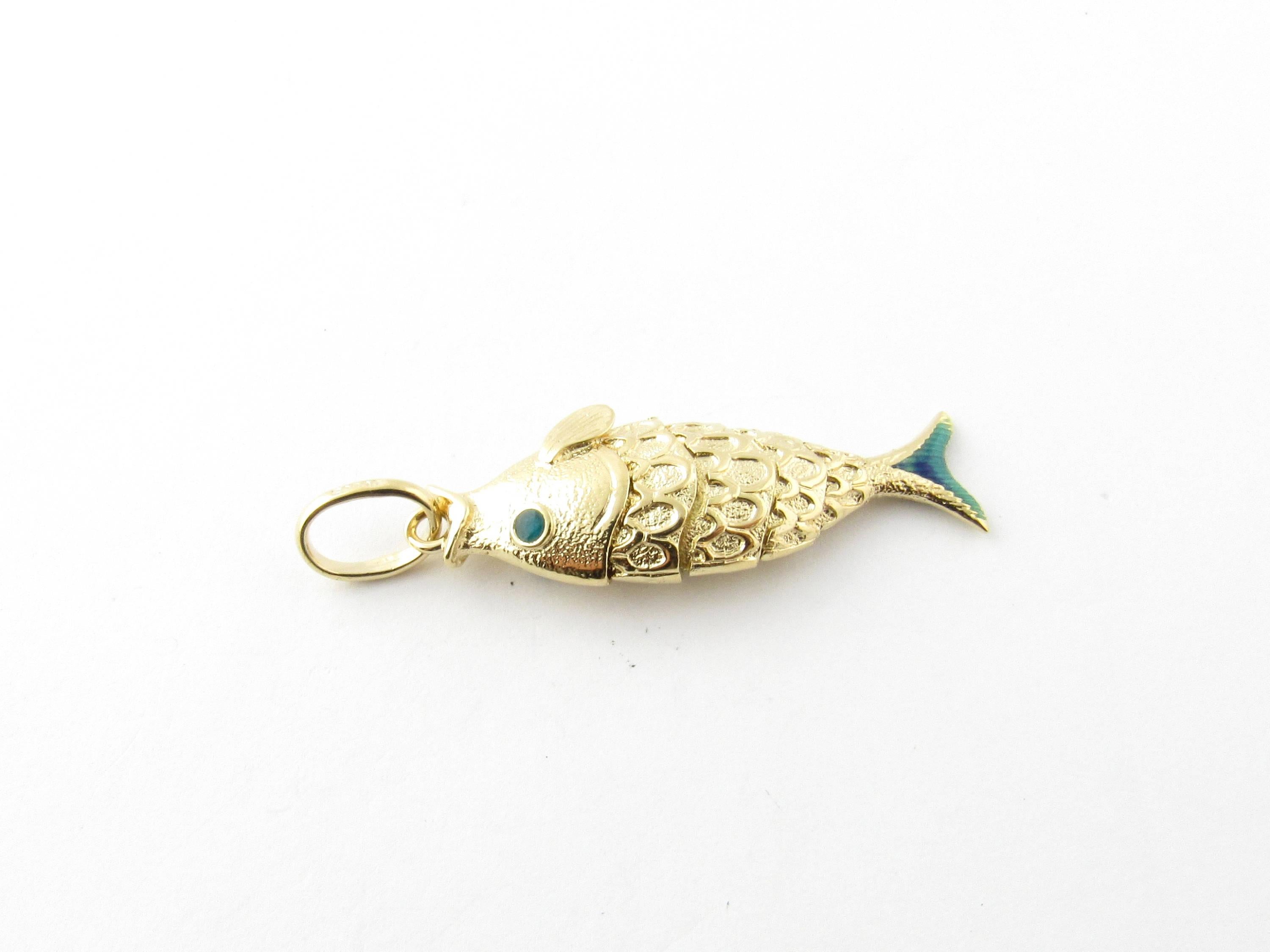 Vintage 18 Karat Yellow Gold Articulated Fish Pendant-

Gone fishing!

This 3D articulated pendant features a flexible fish that wriggles back and forth realistically. Meticulously detailed in 18K yellow gold and accented with green enamel.

Size: 