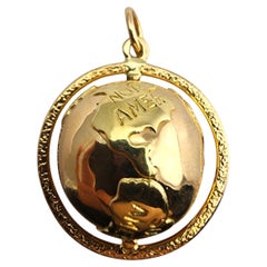 18 Karat Yellow Gold Articulating Globe Pendant #23909