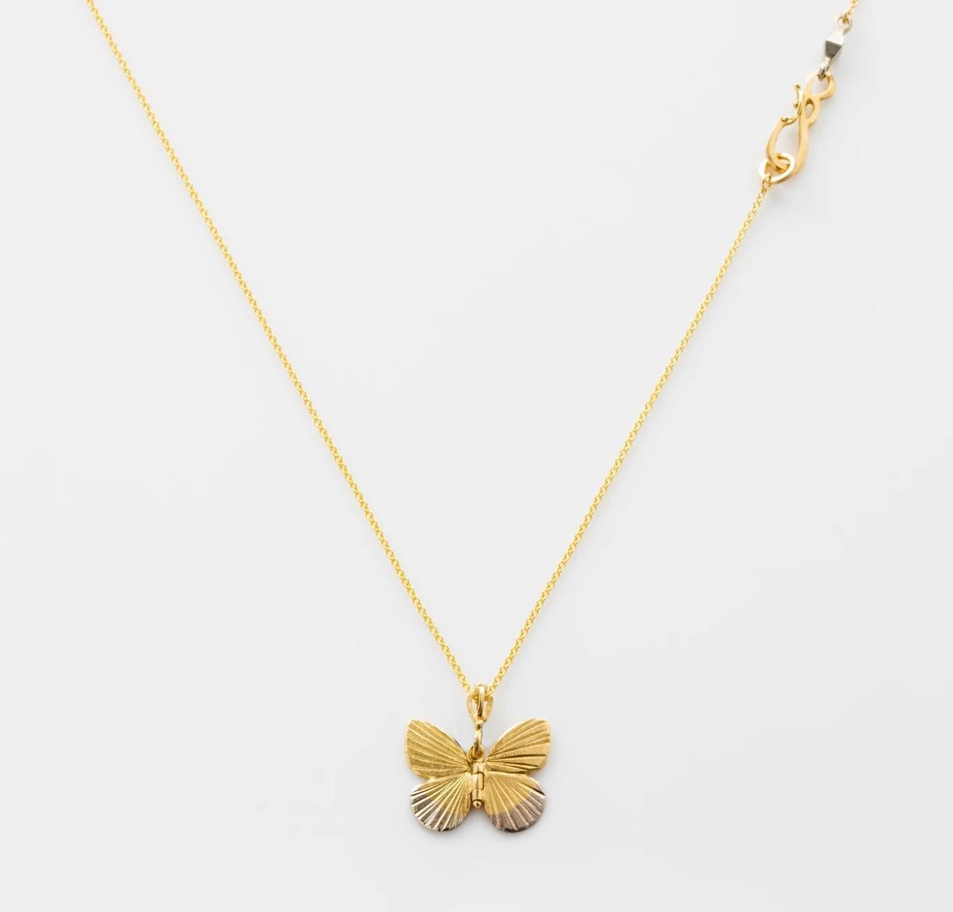 James Banks's signature butterfly necklace features a Baby Asterope butterfly with a hinge at the center to allow movement of the wings, set in 18k Yellow Gold with 18k White Gold tips and hung on an 18k yellow Gold Chain with a secure clasp