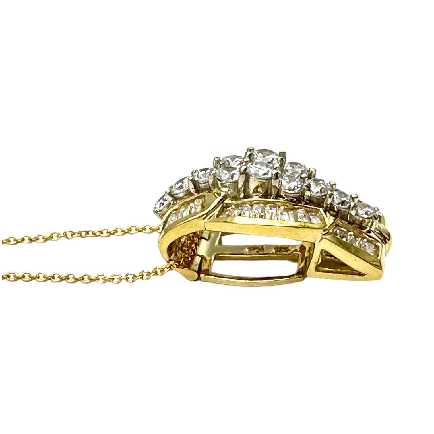 This 18-karat yellow gold diamond pendant-enhancer consists of round and baguette cut diamonds. The total weight of the pendant is 3.50 carats, and the quality is VS1-2 clarity and G color. The length of the pendant is 1.00 and can be used to