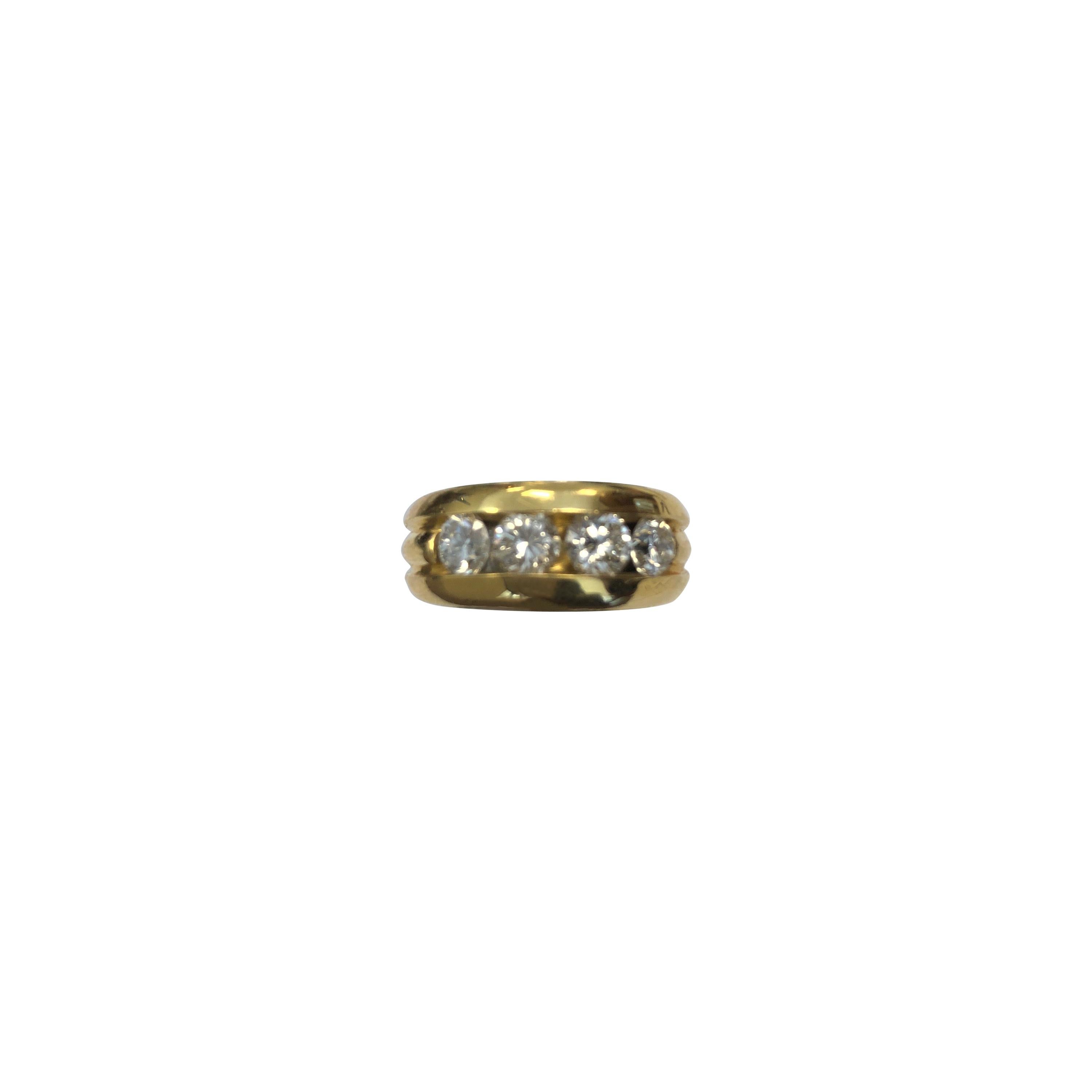 18 Karat Yellow Gold Band Ring Channel Set with Four Round Diamonds For Sale