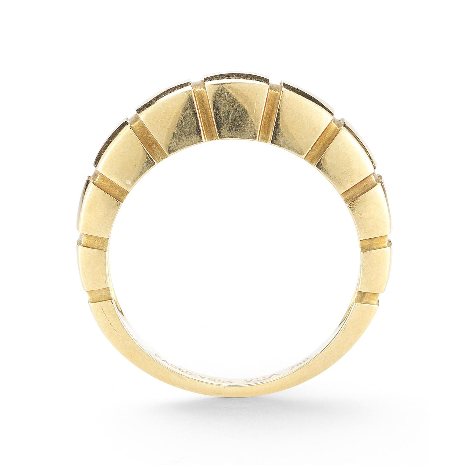 Stack or wear alone! This 18 karat yellow gold Van Cleef & Arpels band style ring is banded in curved cubic sections, signed and numbered VCA FA0501YG54, width 5.5mm. Ring size 7-1/4.  