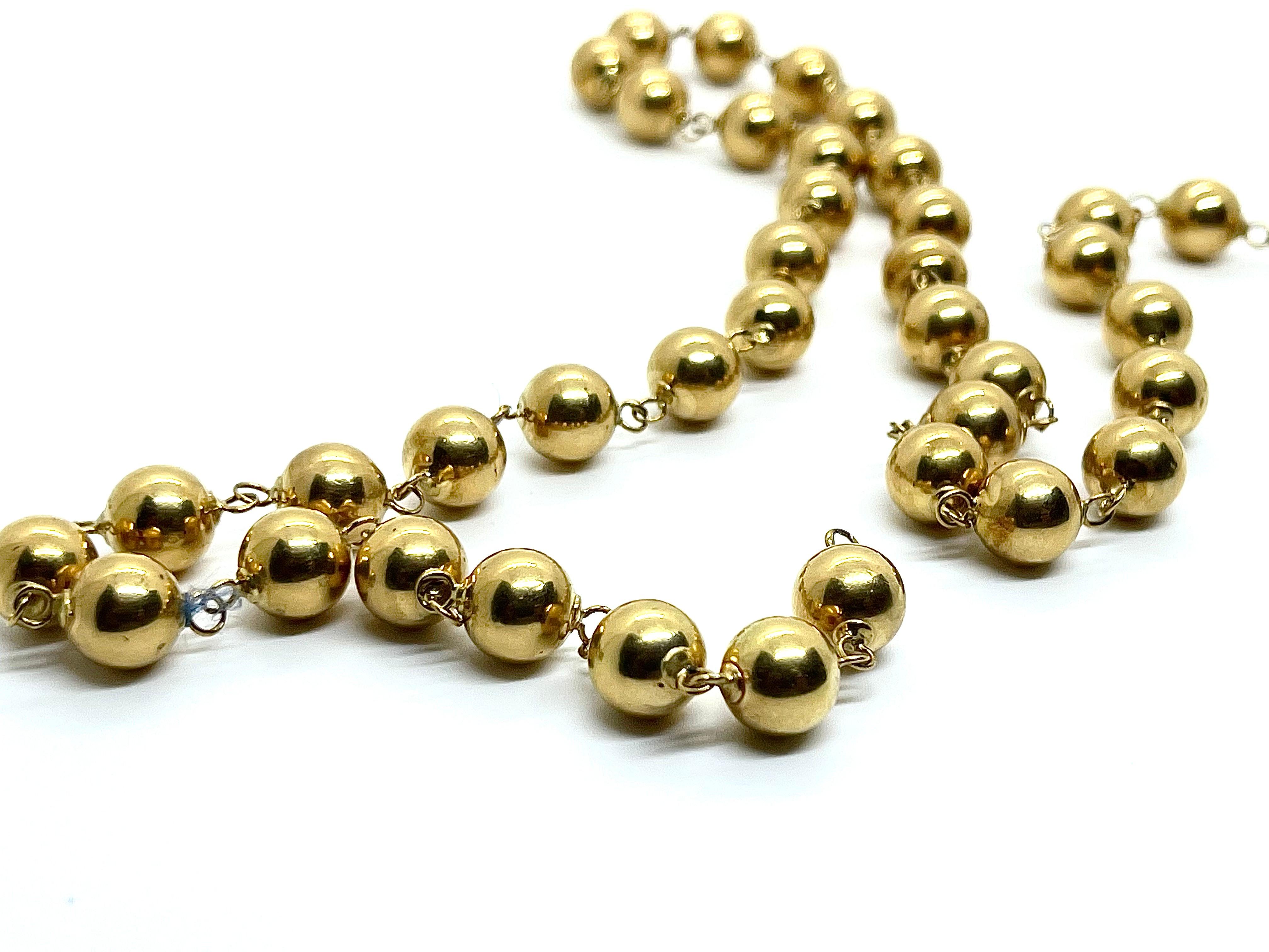 A stunning 18K yellow gold necklace composed of golden beads. Classical but unusual design of this beaded necklace permeates to wear it during the day-time and also for the solemn events and even for gala dinners. It will be appropriate